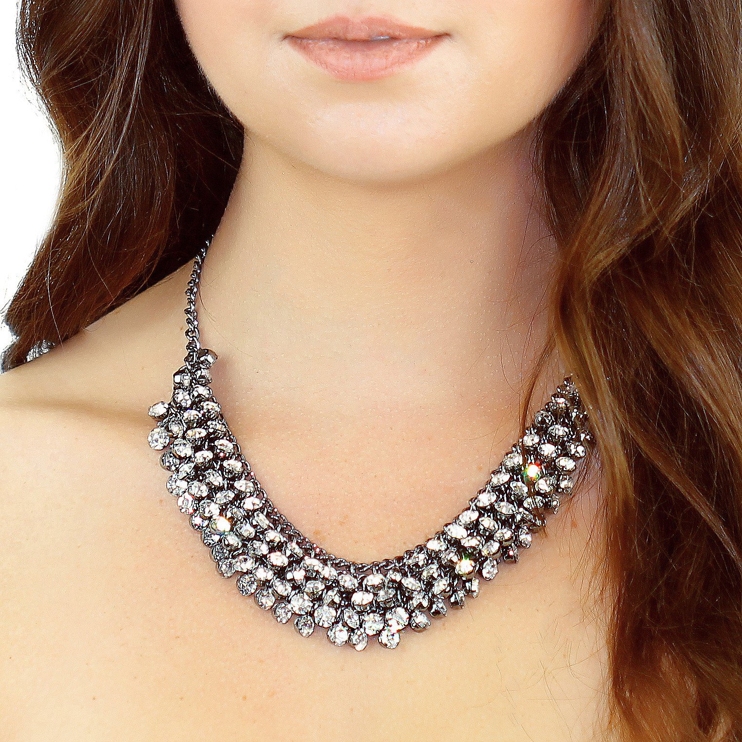 A stunning Crystal Collar Necklace featuring over 140 glass crystals on a dark silver graphite tone chain, perfect for adding sparkle to any outfit.