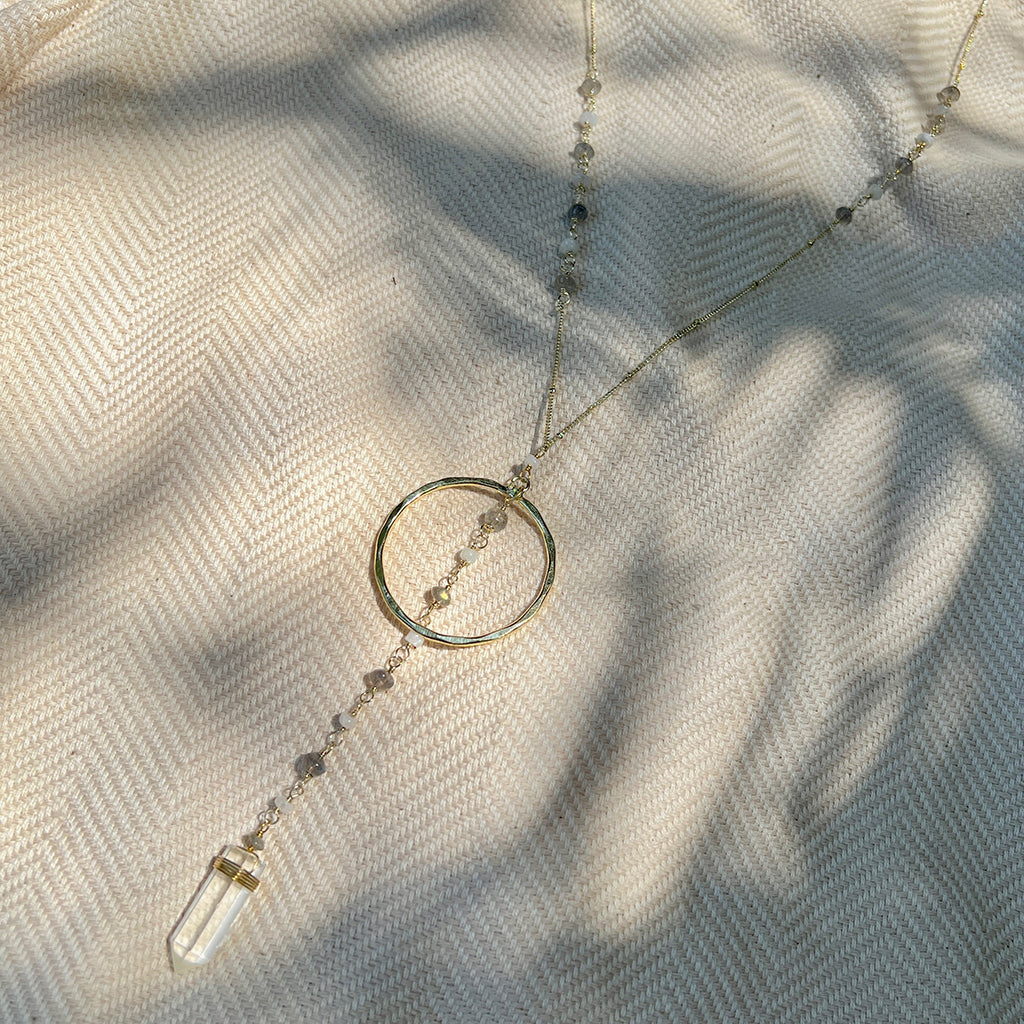 Crystal Halo Y Necklace featuring clear quartz and gemstones, elegantly designed with a cascading pendant.