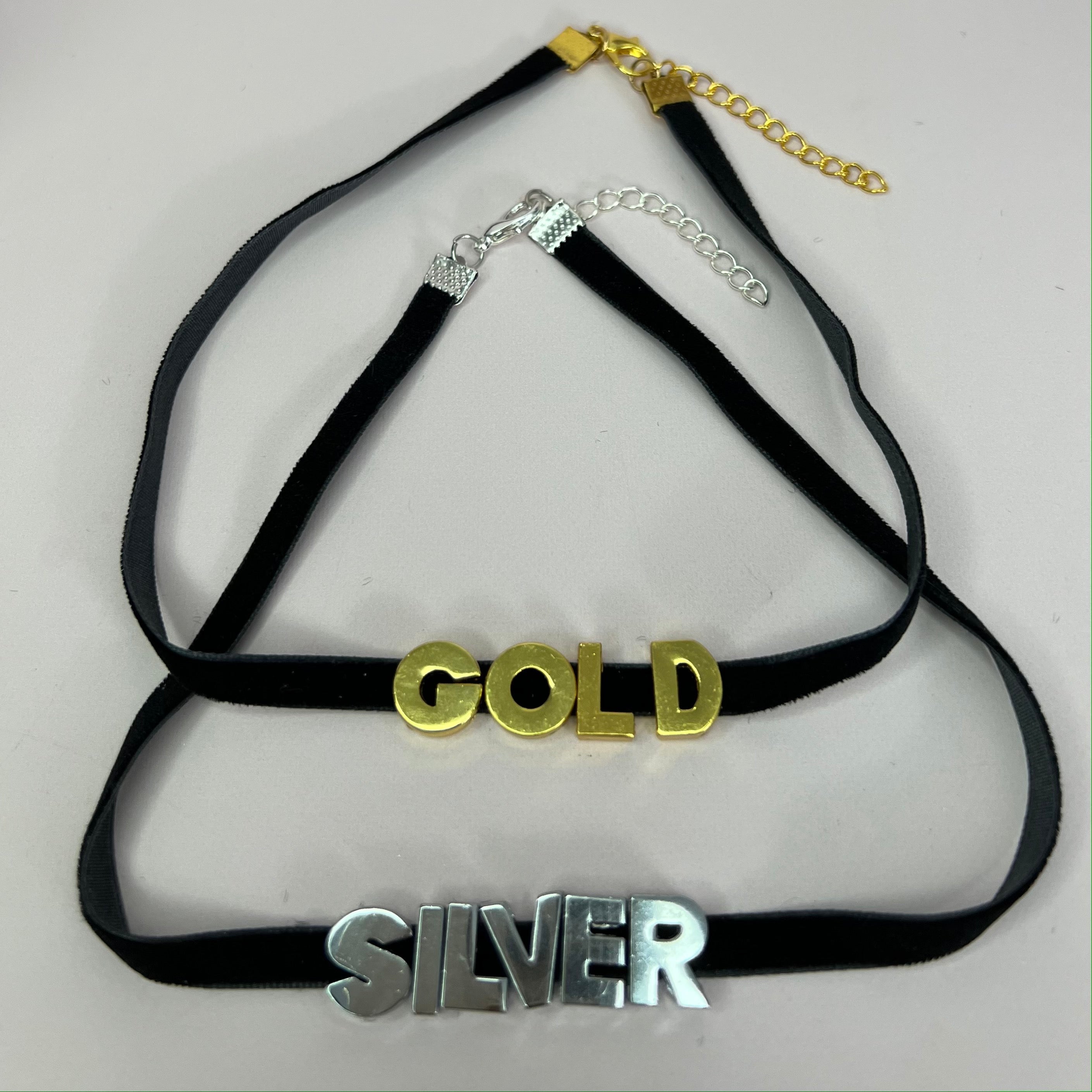 Custom Name Choker Necklace featuring personalized stainless steel letters on a velvet cord, available in gold and silver.