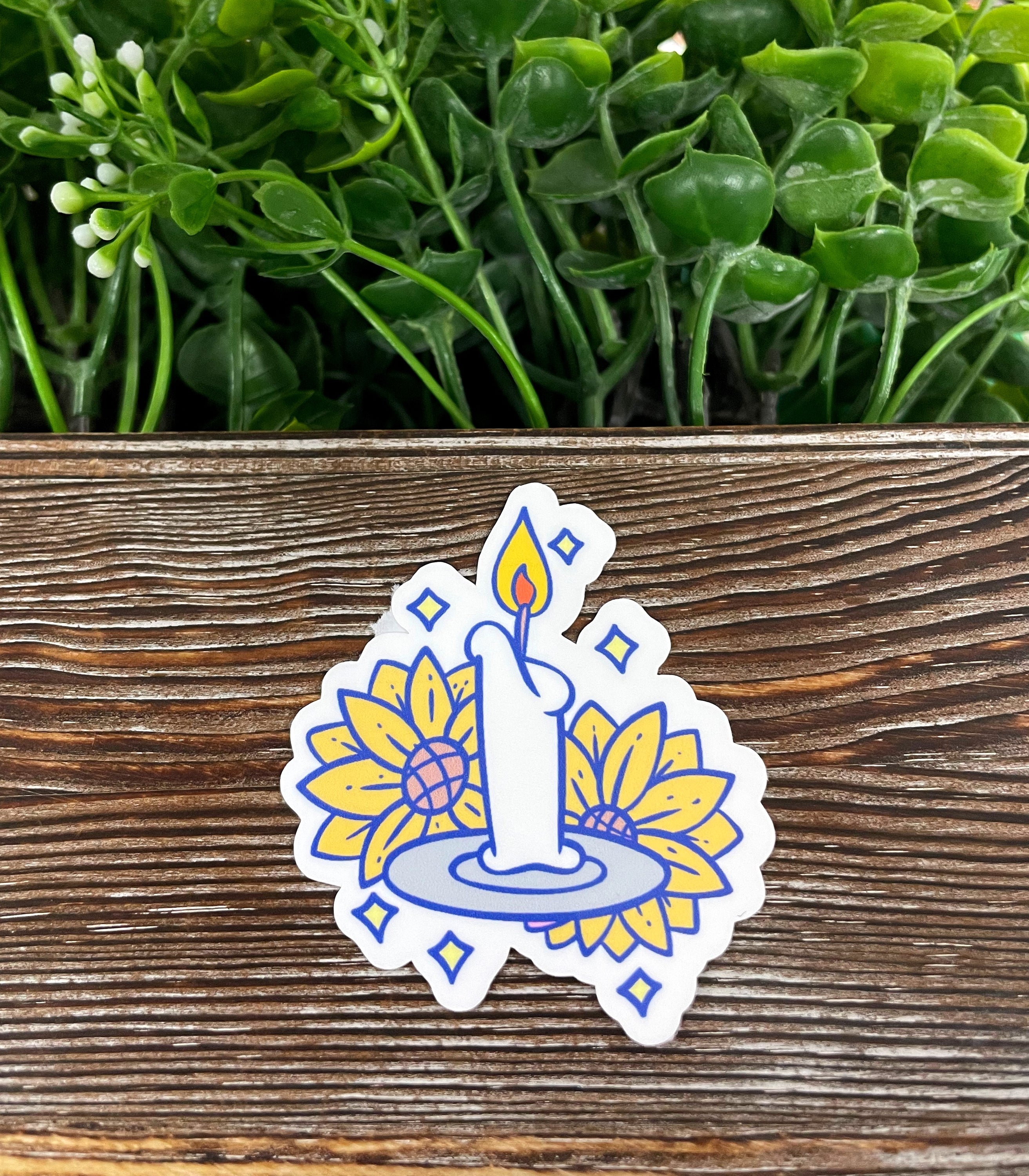 Cute Candle and Sunflowers die cut sticker on a smooth surface, showcasing vibrant colors and intricate design.