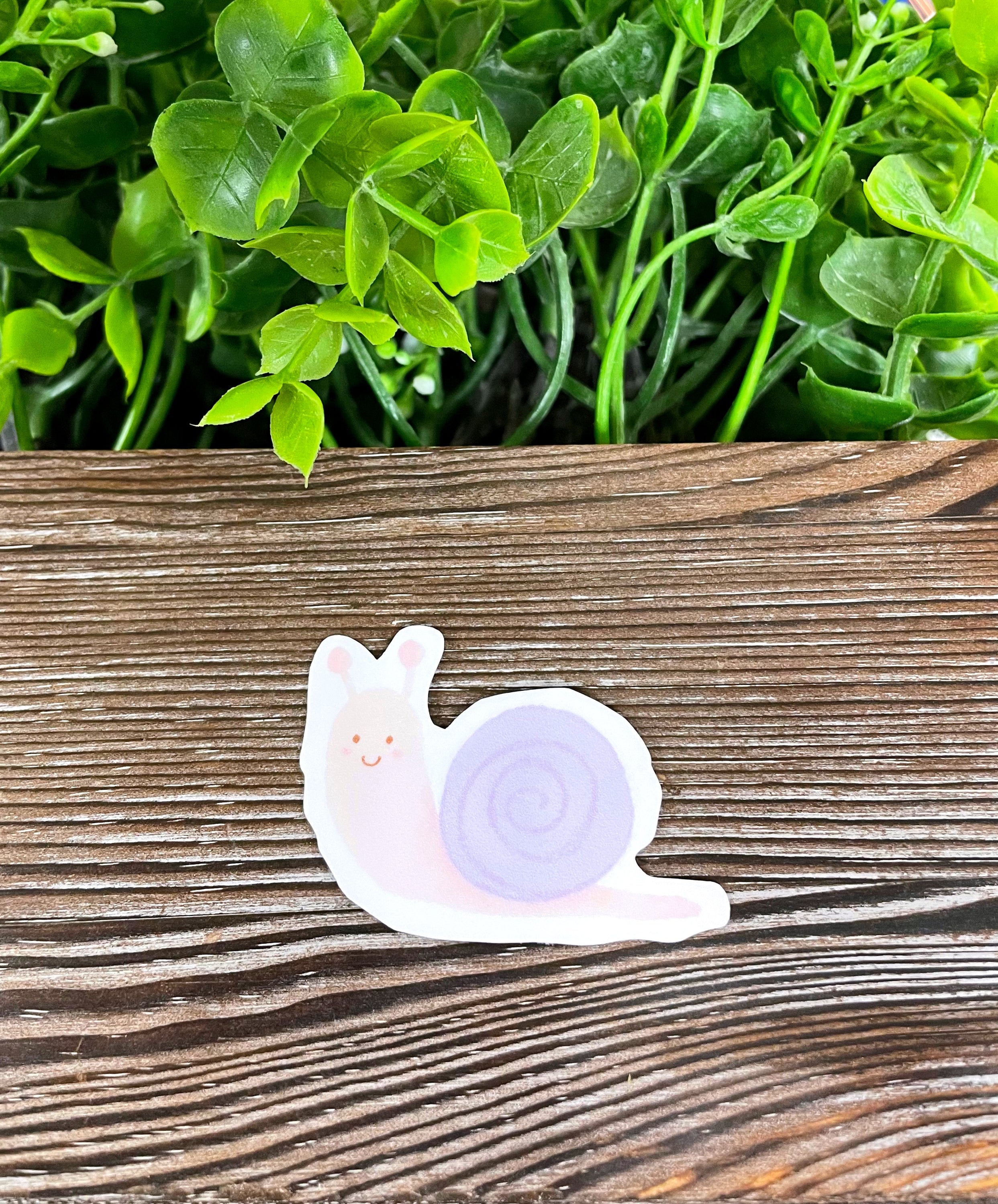 Cute Cartoon Snail die cut vinyl sticker with vibrant colors and whimsical design, perfect for personalizing smooth surfaces.