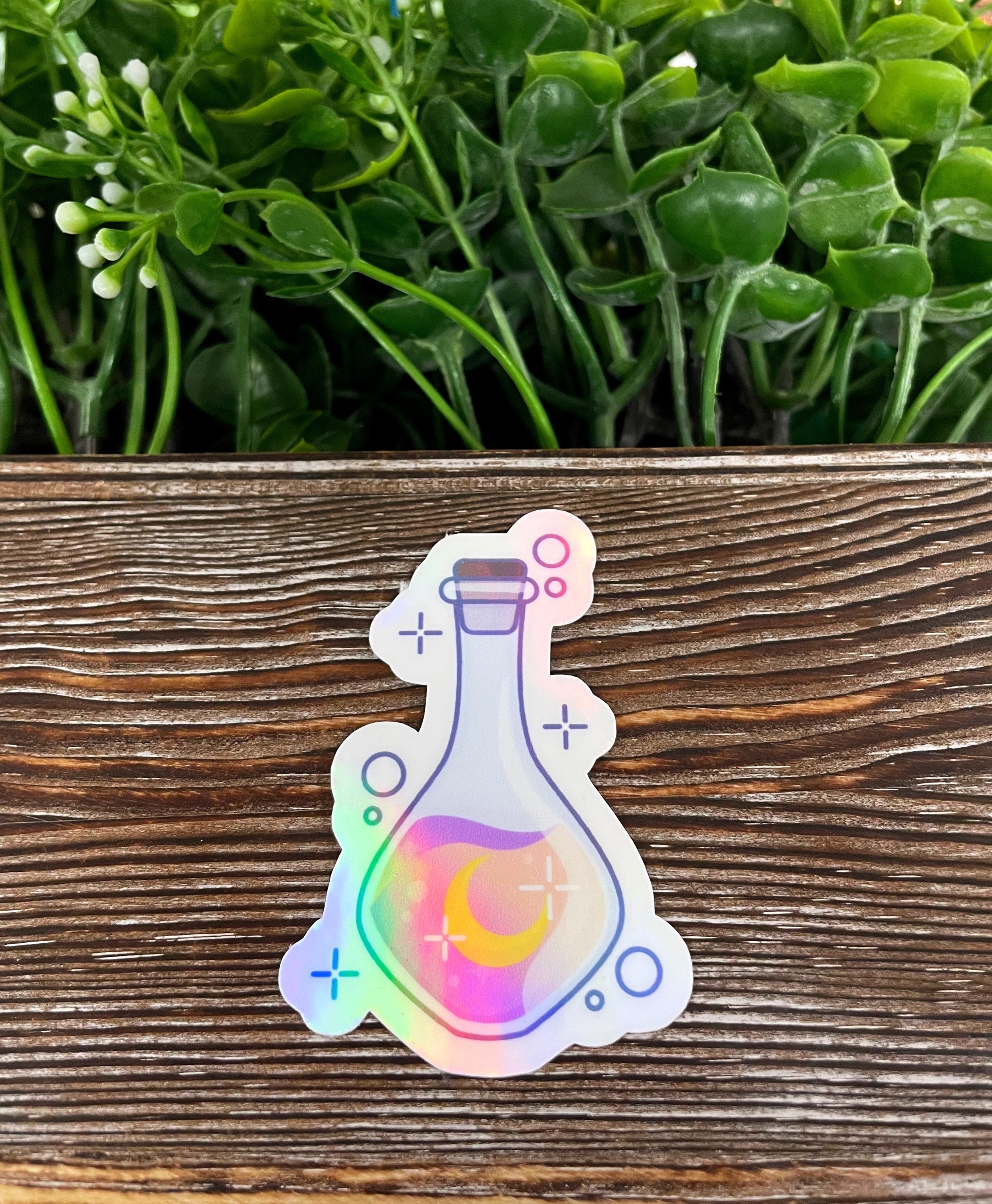 Cute potion bottle die cut sticker on a smooth surface, showcasing vibrant colors and a whimsical design.