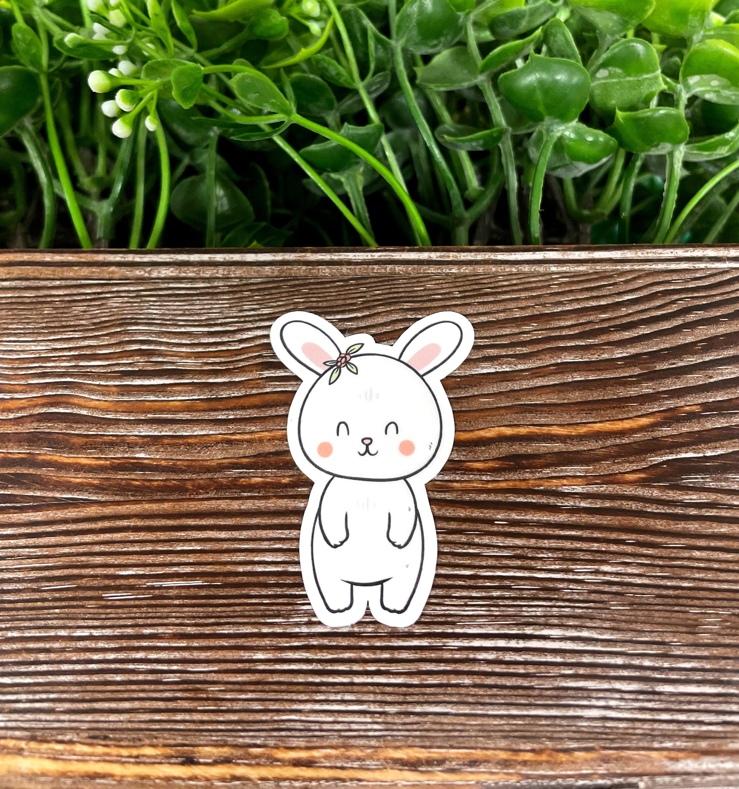 A cute rabbit sticker featuring a whimsical design, perfect for personalizing notebooks, water bottles, and more.