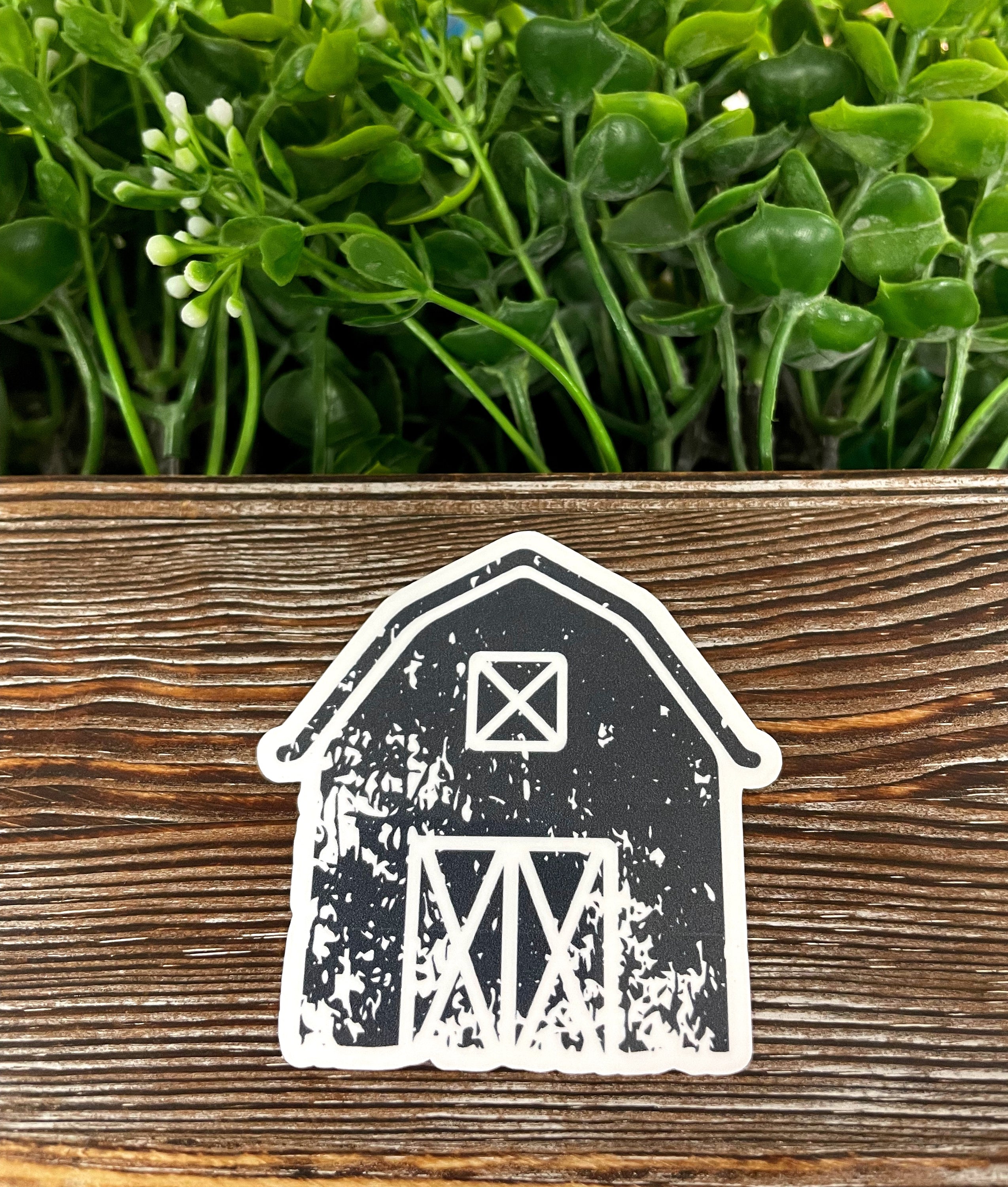 Distressed Farm Barn die cut vinyl sticker on a smooth surface, showcasing boho fun design with rustic elements.