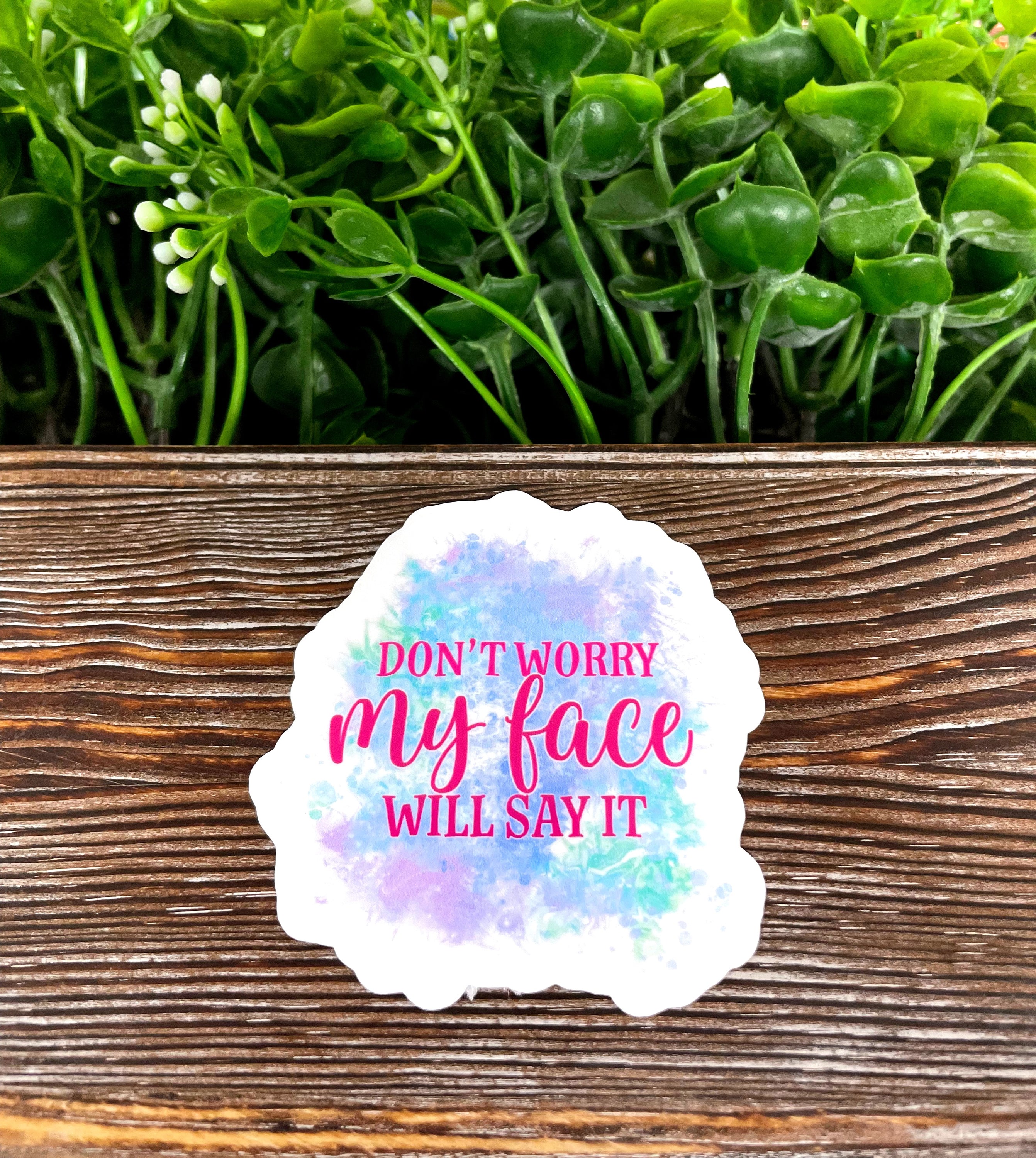 A vibrant die-cut sticker featuring the phrase 'Don't Worry My Face will Say it', showcasing its quality vinyl and water-resistant laminate finish.