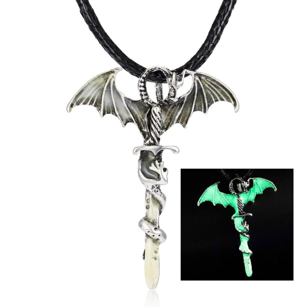 A glowing dragon pendant on a rope necklace, showcasing intricate details in blue, blue-green, and yellow-green colors.