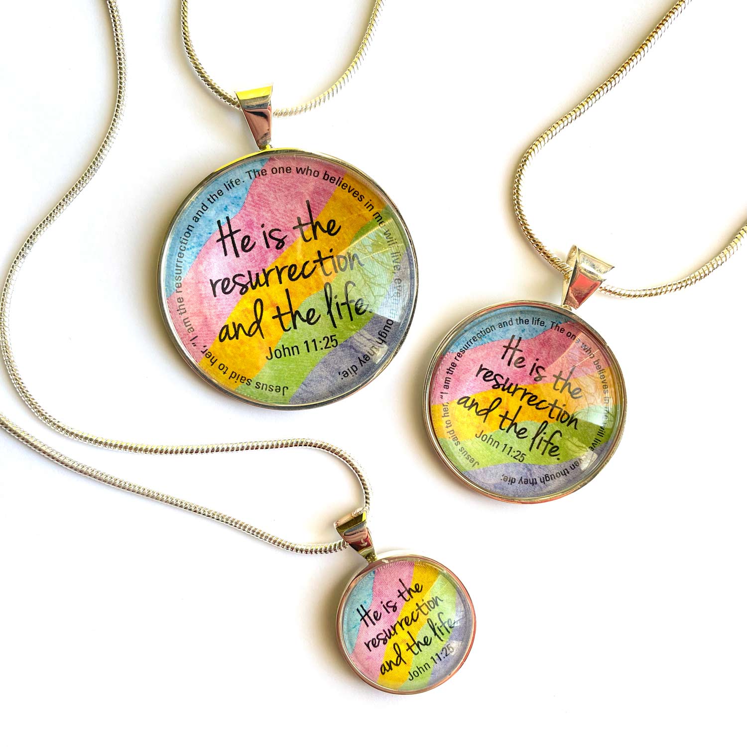 Easter Scripture Silver-Plated Colorful Christian Pendant Necklace featuring vibrant spring colors and a scripture verse from John 11:25.