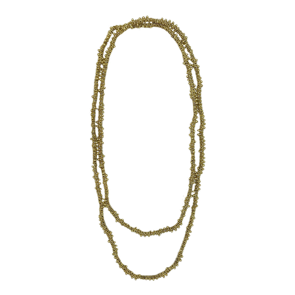 Elina Necklace featuring woven metal beads and cotton thread, showcasing its vibrant colors and unique design.