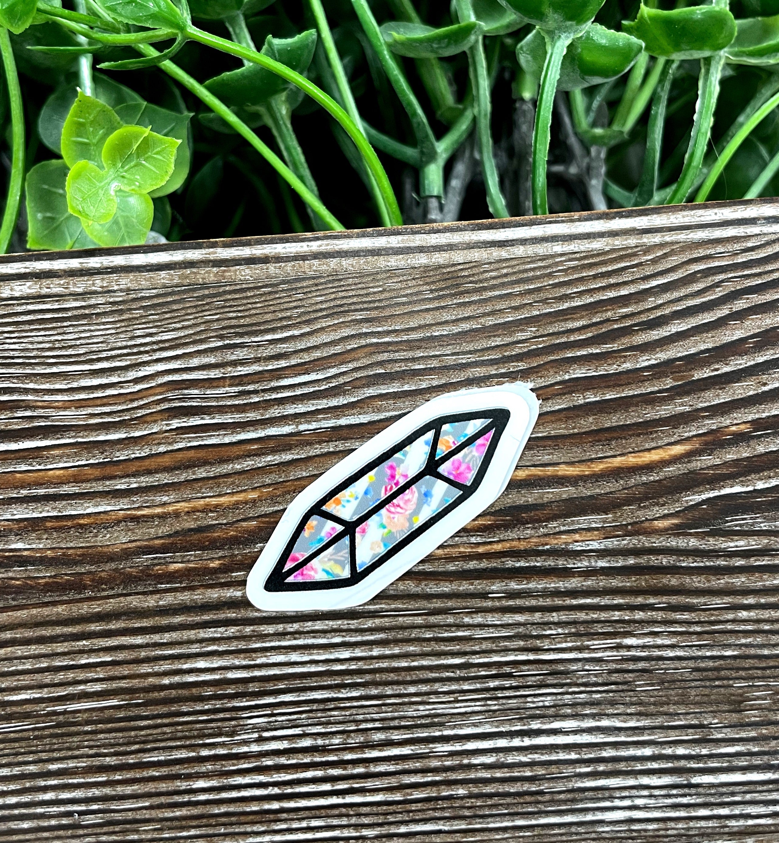 Flower Crystal Die Cut Sticker featuring vibrant floral design on a smooth surface, ideal for personalizing items.