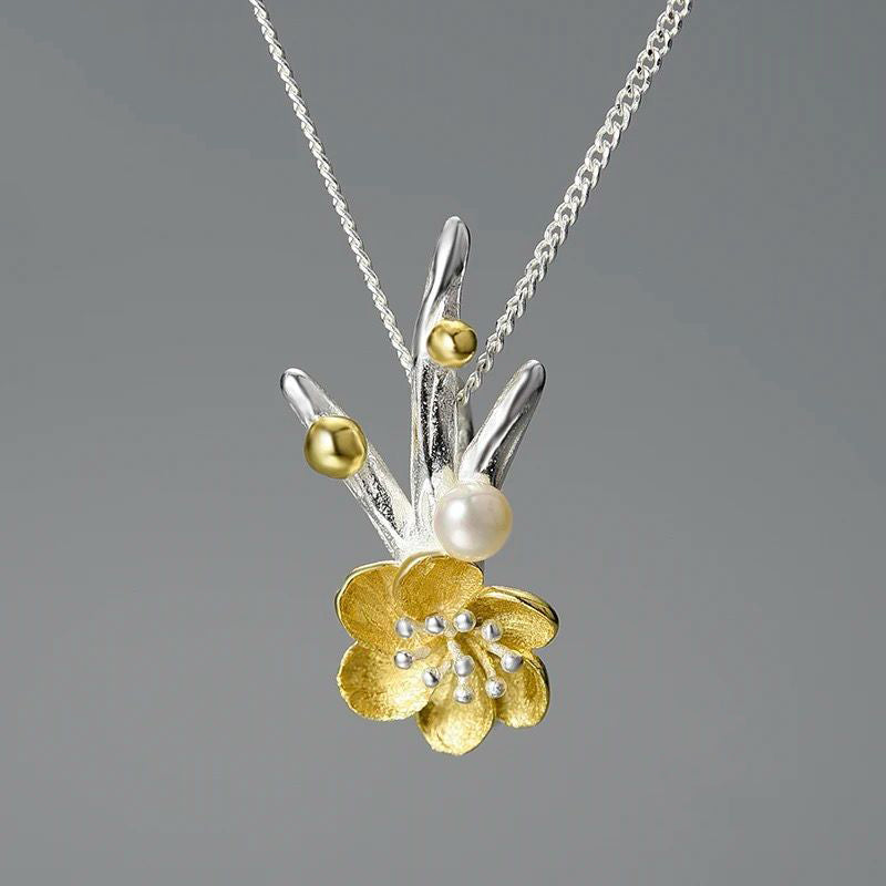 Elegant Flower Necklace featuring a pearl, crafted from sterling silver and gold-plated, showcasing a detailed Adonis flower design.