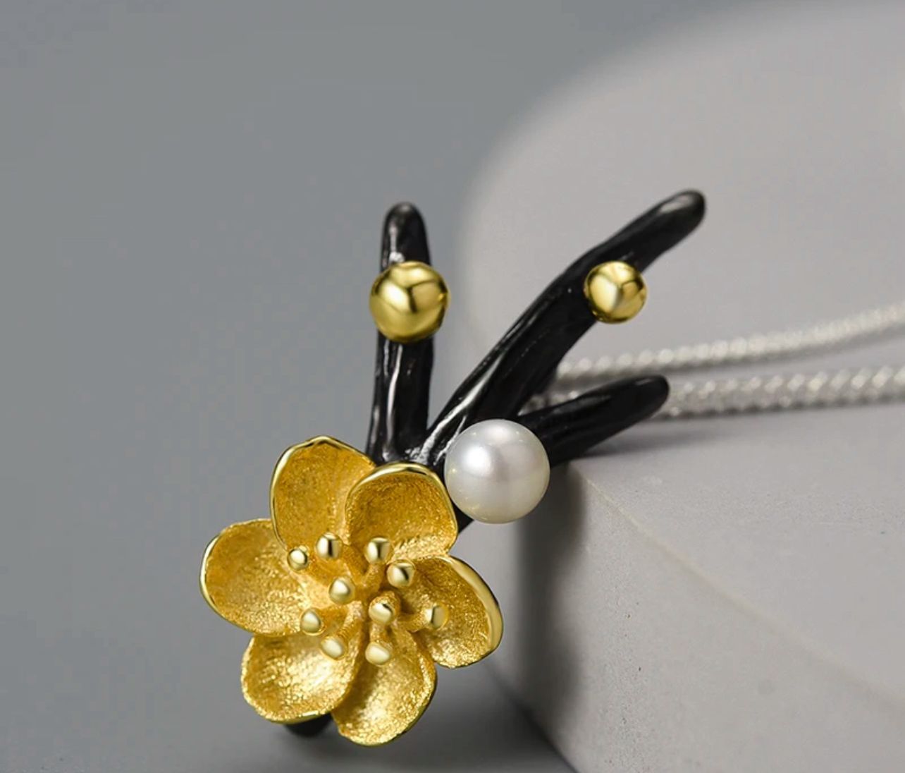 Elegant Flower Necklace featuring a pearl, crafted from sterling silver and gold-plated, showcasing a detailed Adonis flower design.