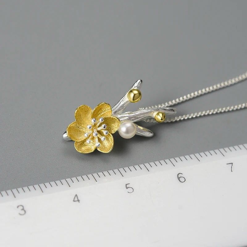 Elegant Flower Necklace featuring a pearl, crafted from sterling silver and gold-plated, showcasing a detailed Adonis flower design.