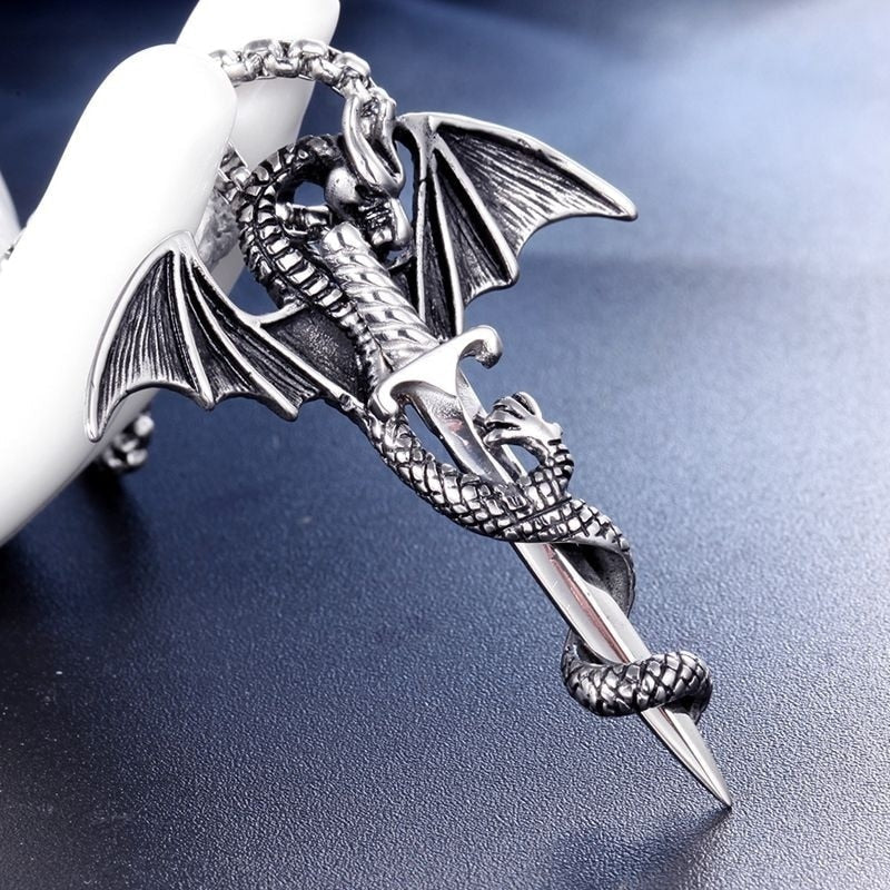 A stunning Flying Dragon With Sword Necklace in gold and silver, showcasing intricate details of the dragon and sword pendant.