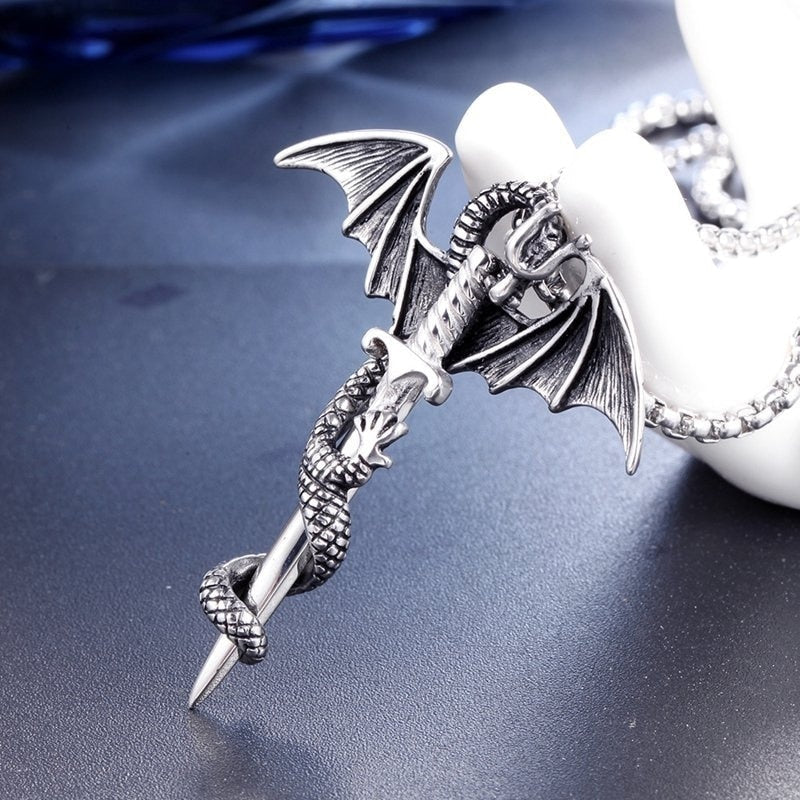 A stunning Flying Dragon With Sword Necklace in gold and silver, showcasing intricate details of the dragon and sword pendant.