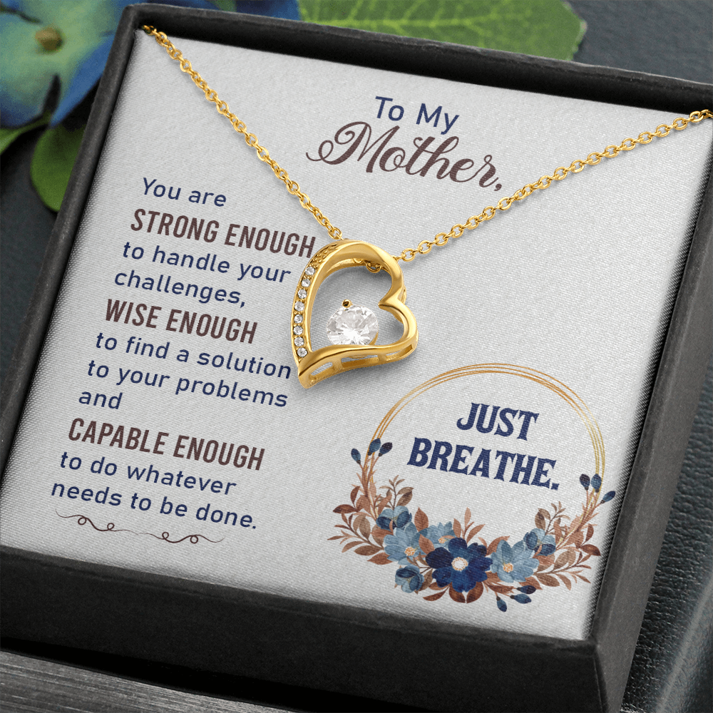 Forever Love Necklace featuring a heart pendant with cubic zirconia, available in white and yellow gold finishes.