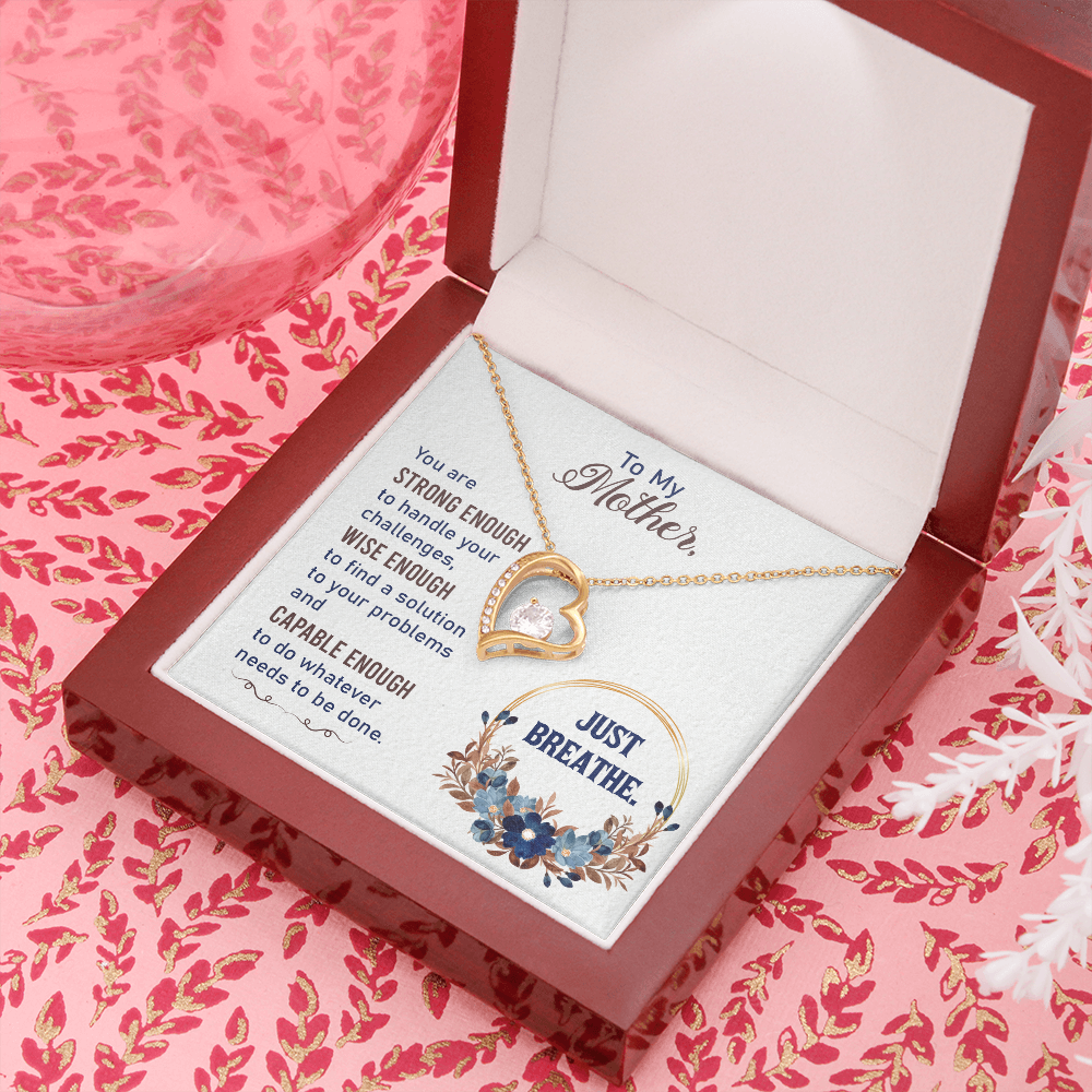 Forever Love Necklace featuring a heart pendant with cubic zirconia, available in white and yellow gold finishes.