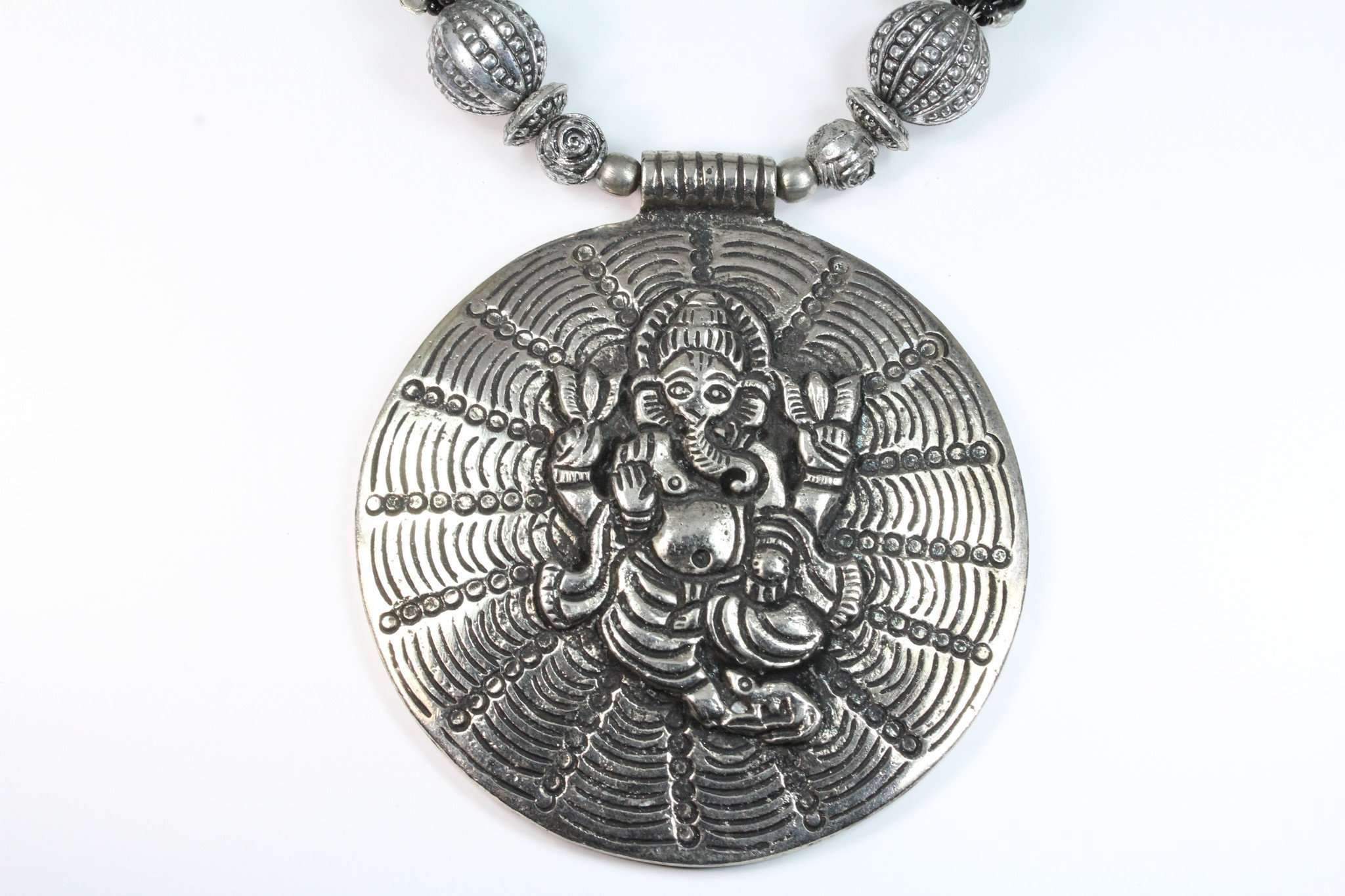 Handcrafted Ganesha in Cosmos Statement Necklace featuring black and silvertone beads with a large Ganesha pendant.