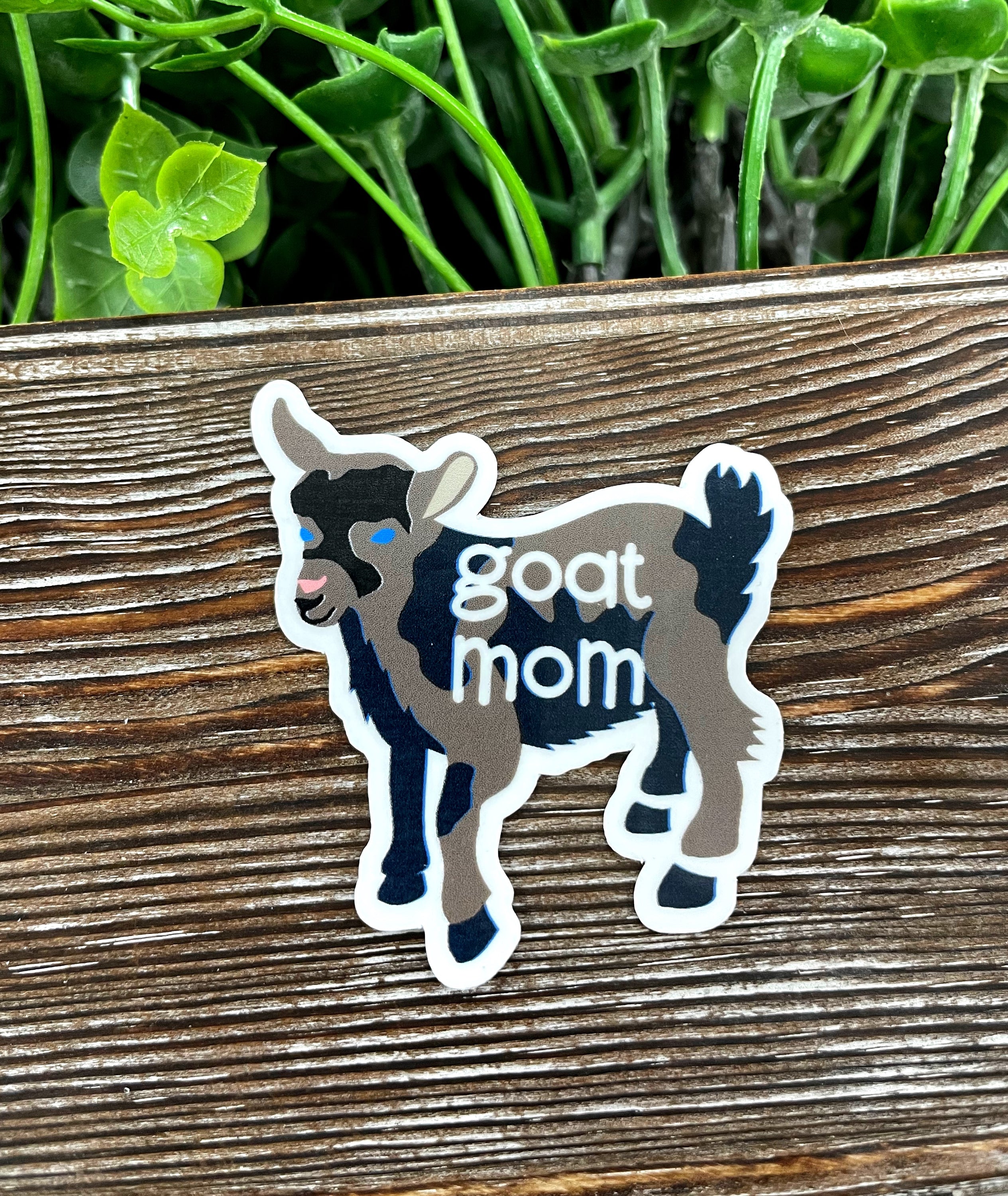 Goat Mom Die Cut Sticker featuring a playful goat graphic on a vibrant background, perfect for personalizing items.