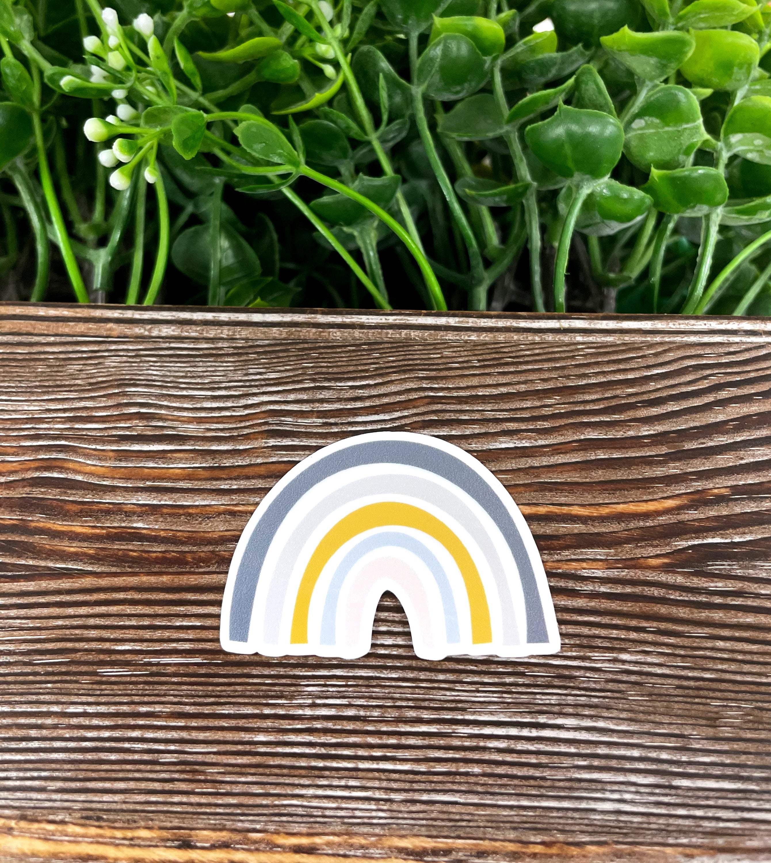 Grey Yellow Bohemian Rainbow die cut vinyl sticker on a smooth surface, showcasing vibrant colors and boho design.