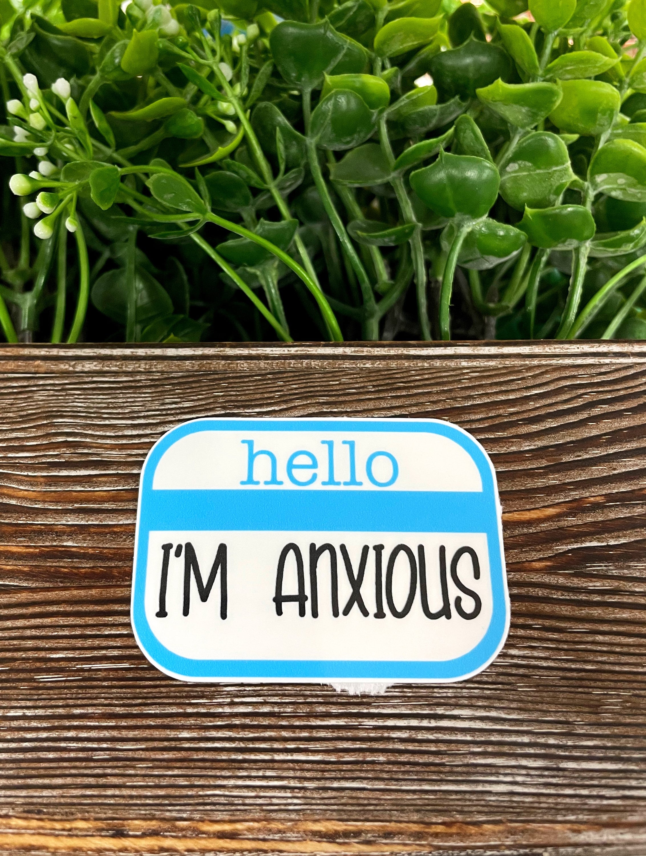 Hello I'm Anxious Badge die cut vinyl sticker featuring a boho design, perfect for personalizing various smooth surfaces.