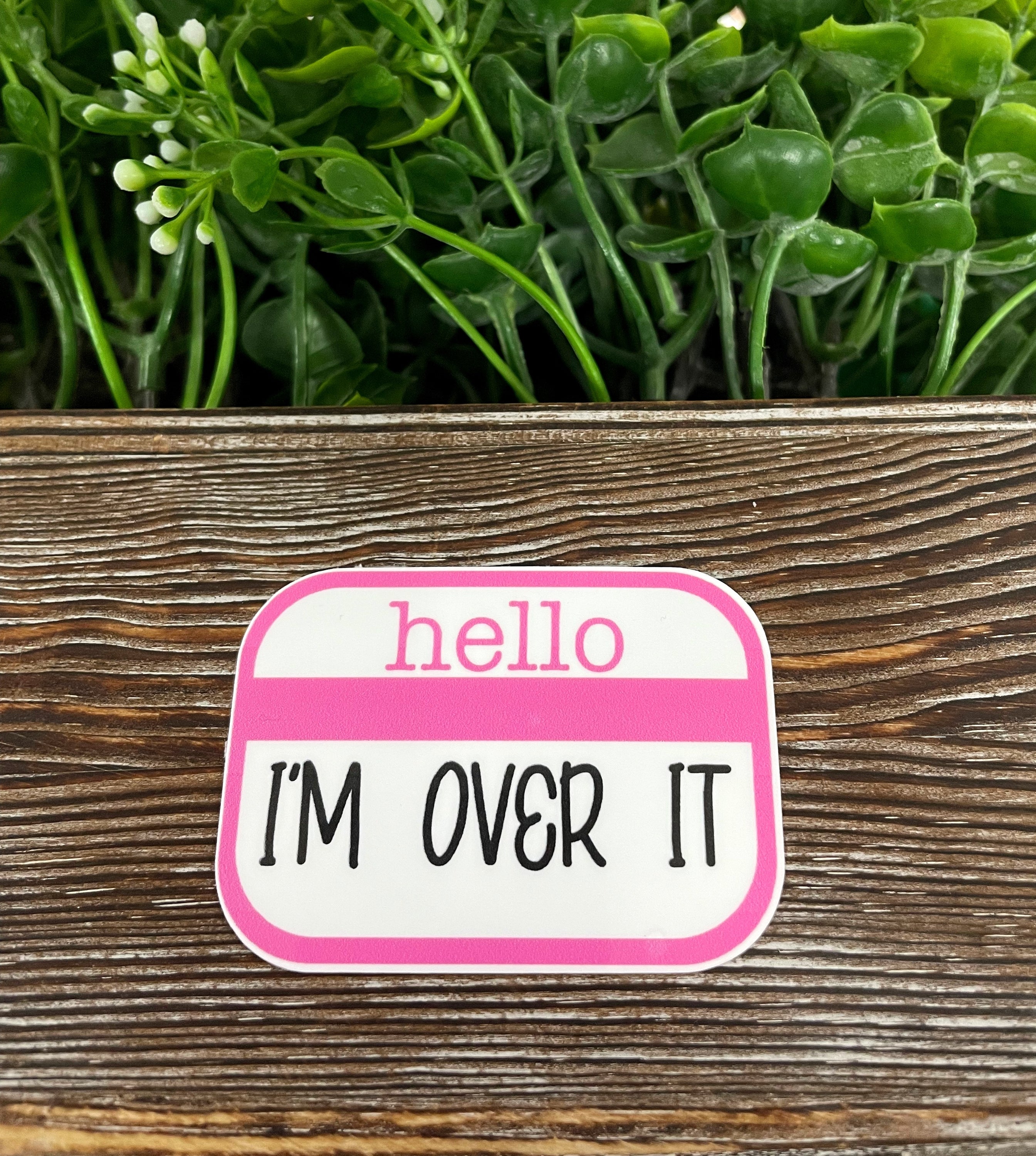 Hello I'm Over It die cut sticker featuring a colorful graphic design, perfect for personalizing various surfaces.