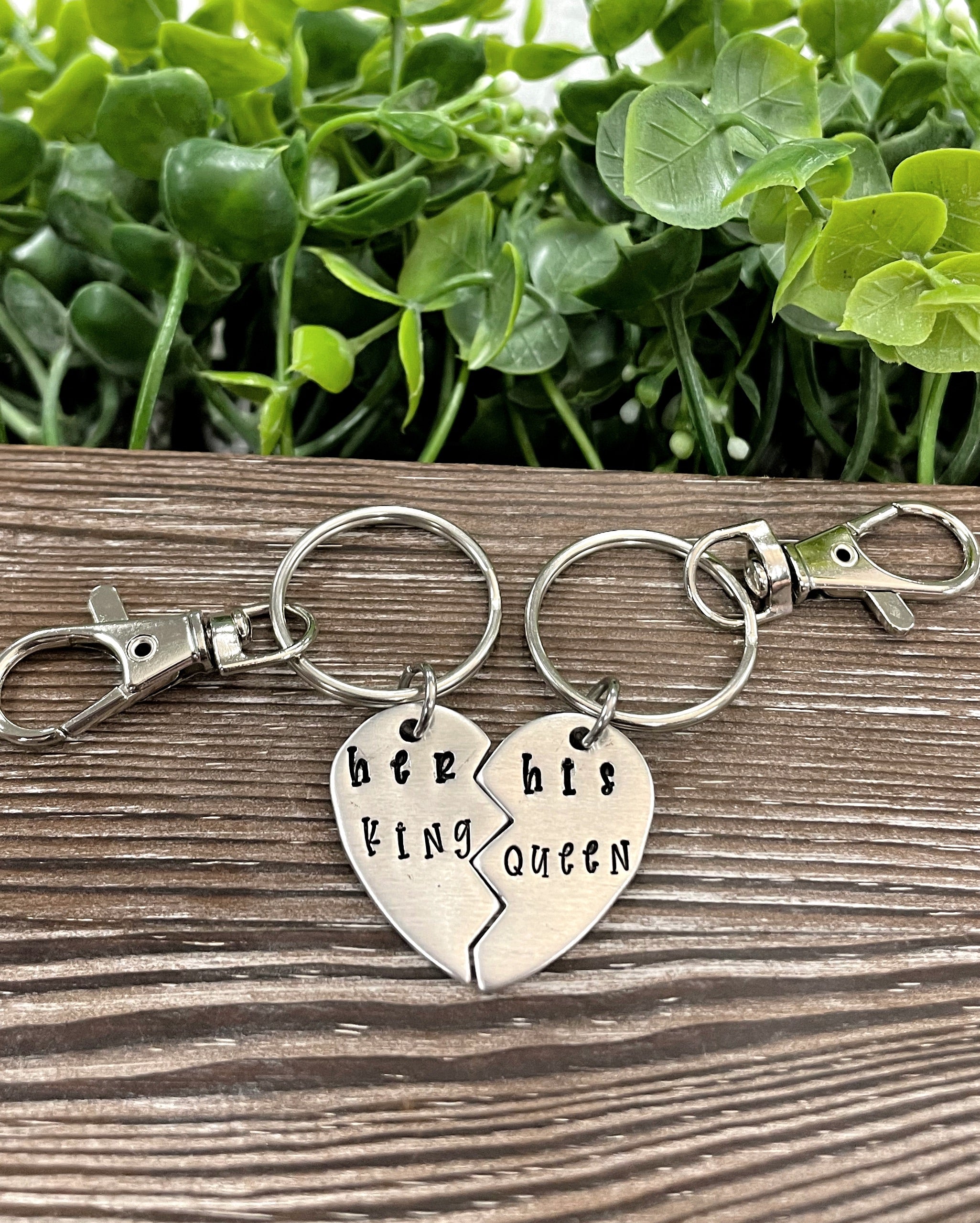 Hand-stamped keychain set featuring 'Her King His Queen' design, showcasing unique lettering and craftsmanship.