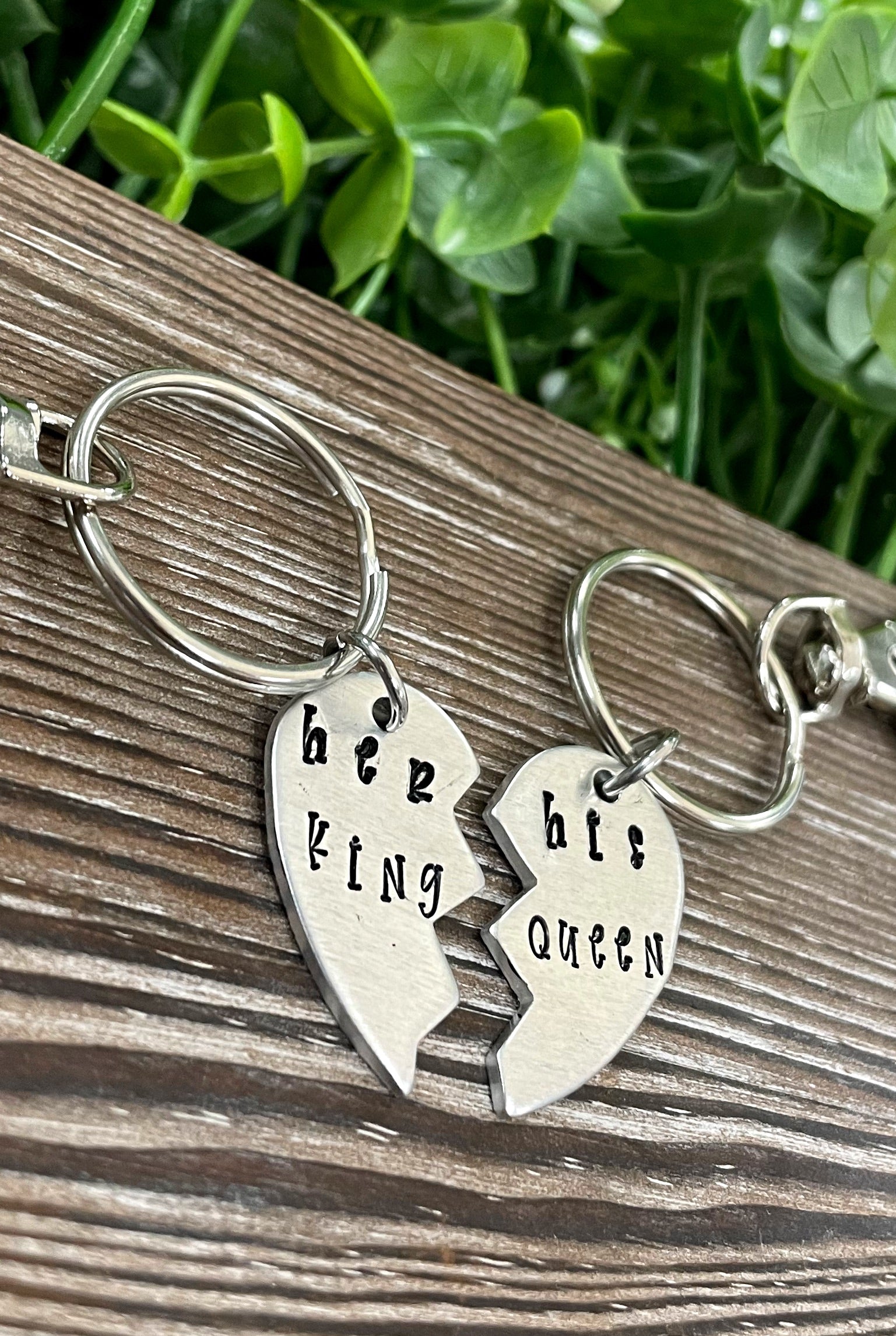 Hand-stamped keychain set featuring 'Her King His Queen' design, showcasing unique lettering and craftsmanship.