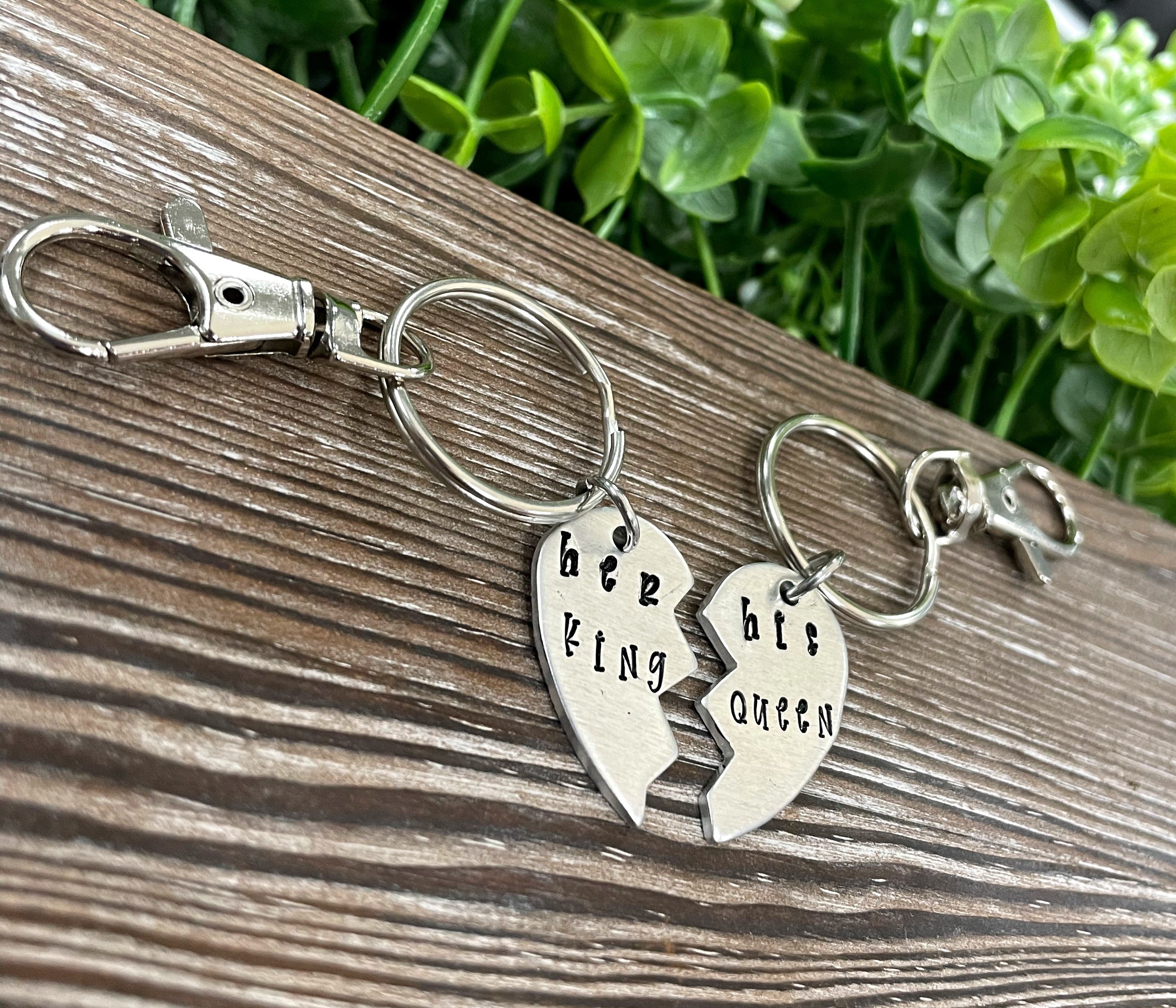 Hand-stamped keychain set featuring 'Her King His Queen' design, showcasing unique lettering and craftsmanship.