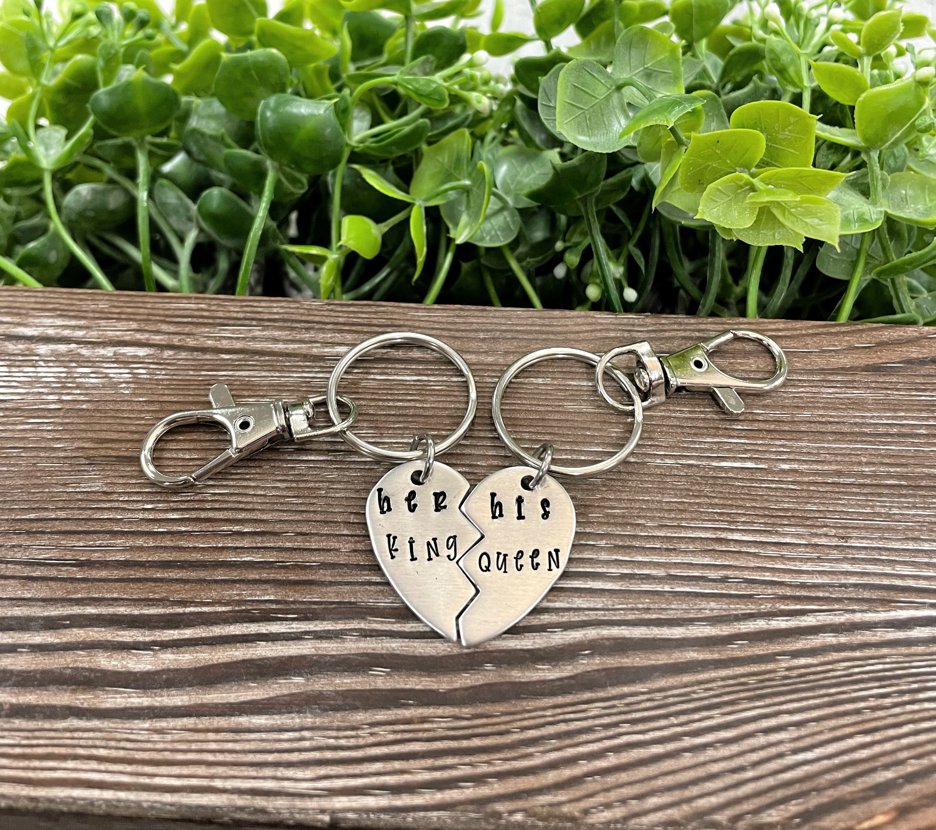 Hand-stamped keychain set featuring 'Her King His Queen' design, showcasing unique lettering and craftsmanship.