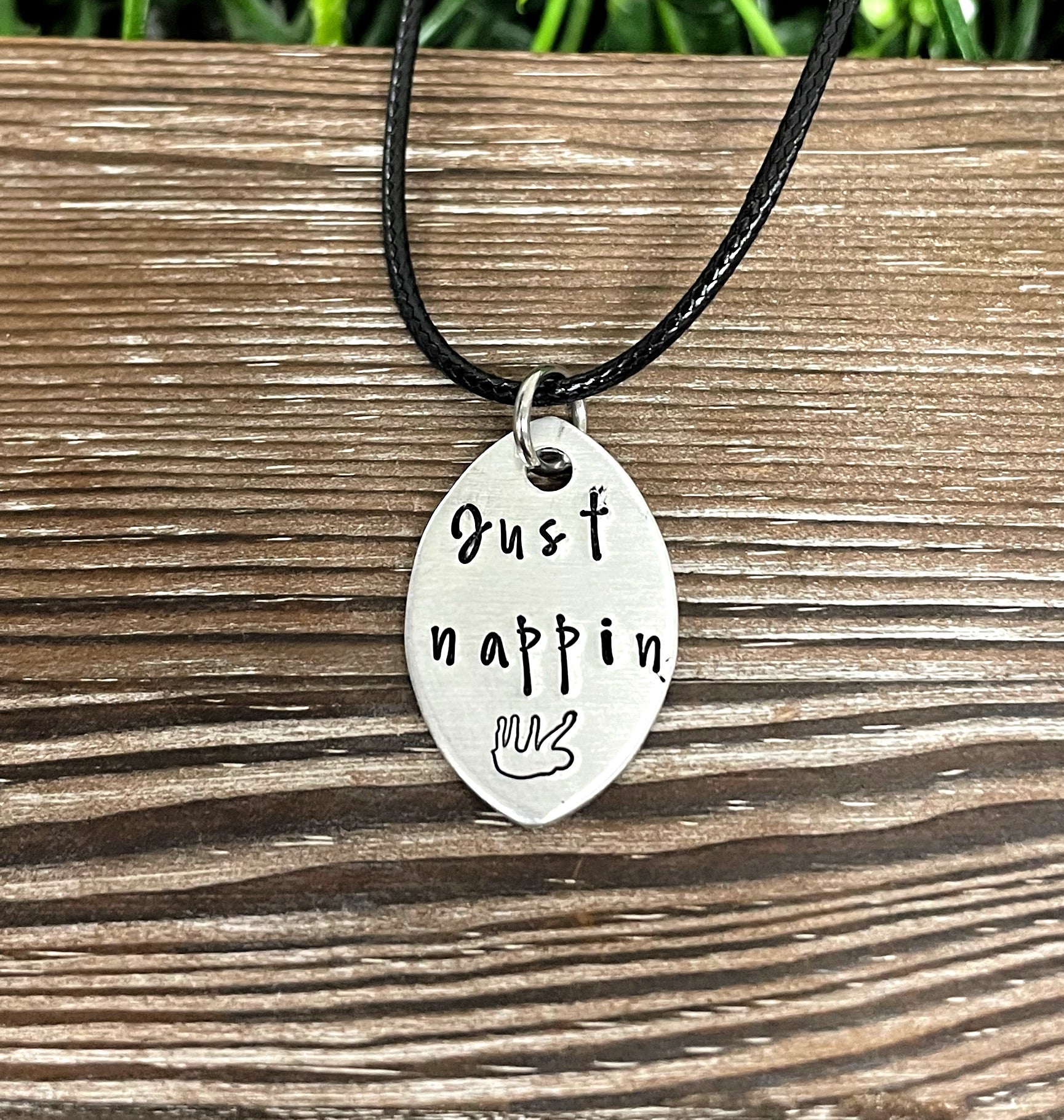 Hand-stamped Just Nappin Sloth necklace featuring unique lettering and design, perfect for animal lovers.