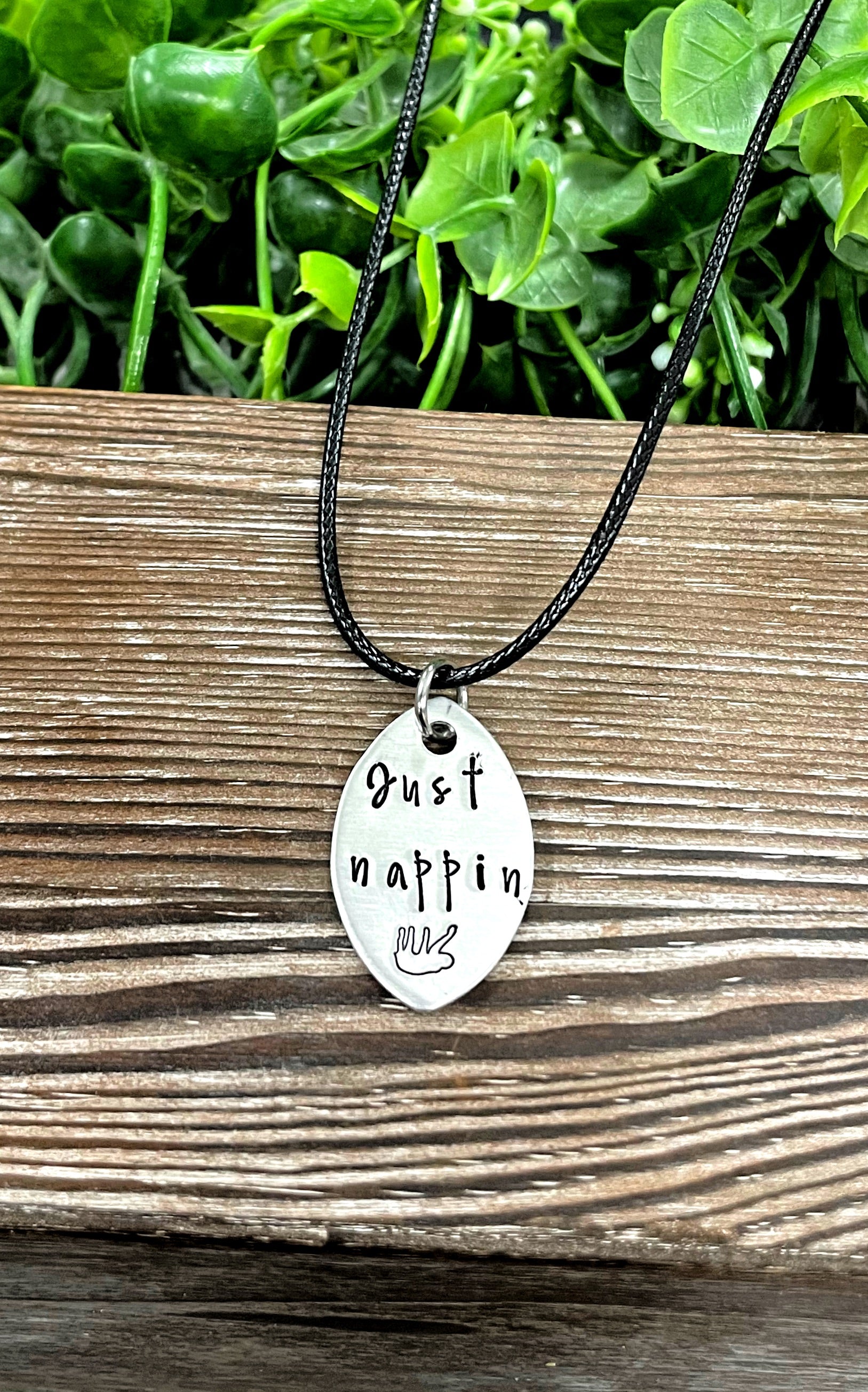 Hand-stamped Just Nappin Sloth necklace featuring unique lettering and design, perfect for animal lovers.