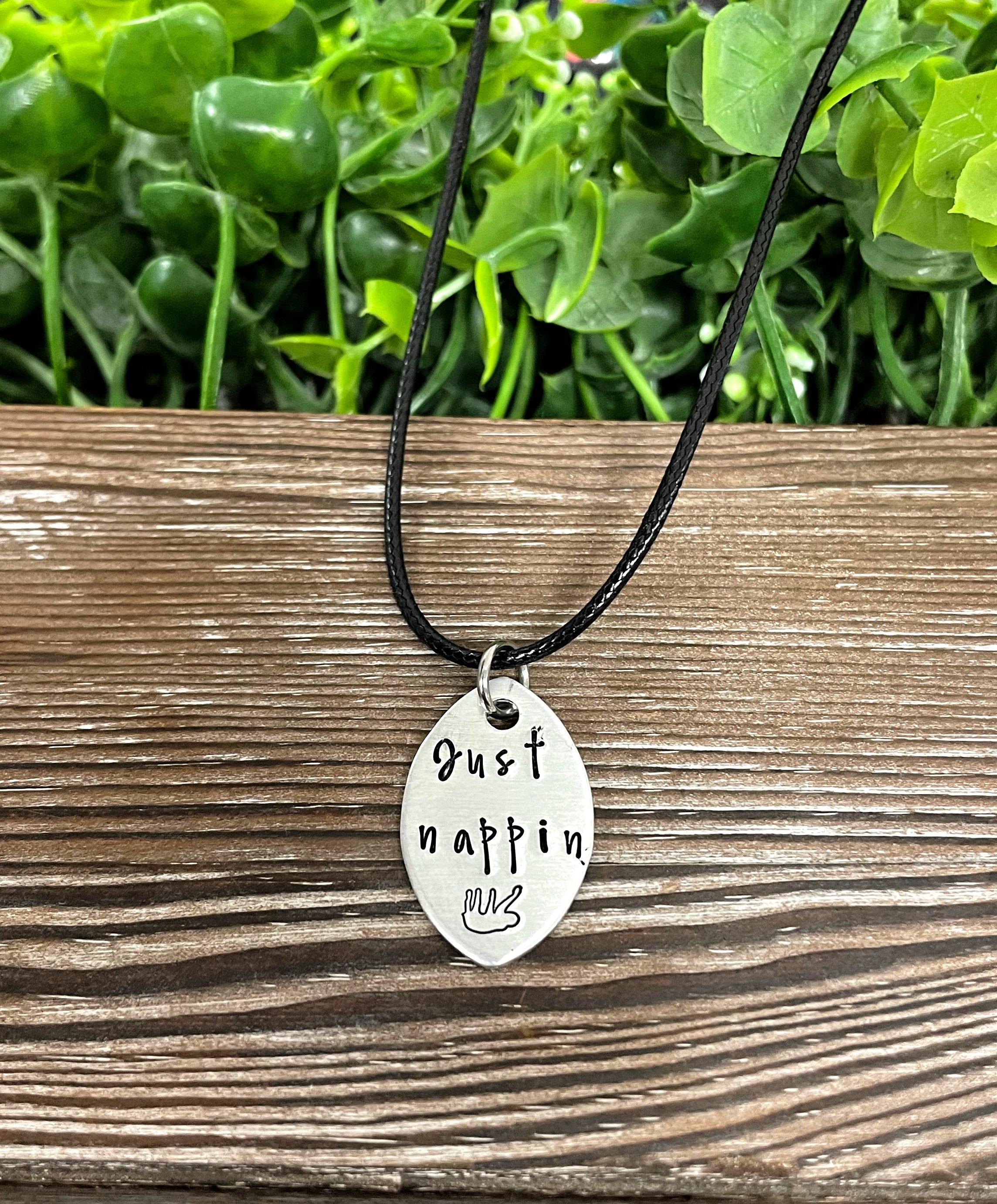 Hand-stamped Just Nappin Sloth necklace featuring unique lettering and design, perfect for animal lovers.