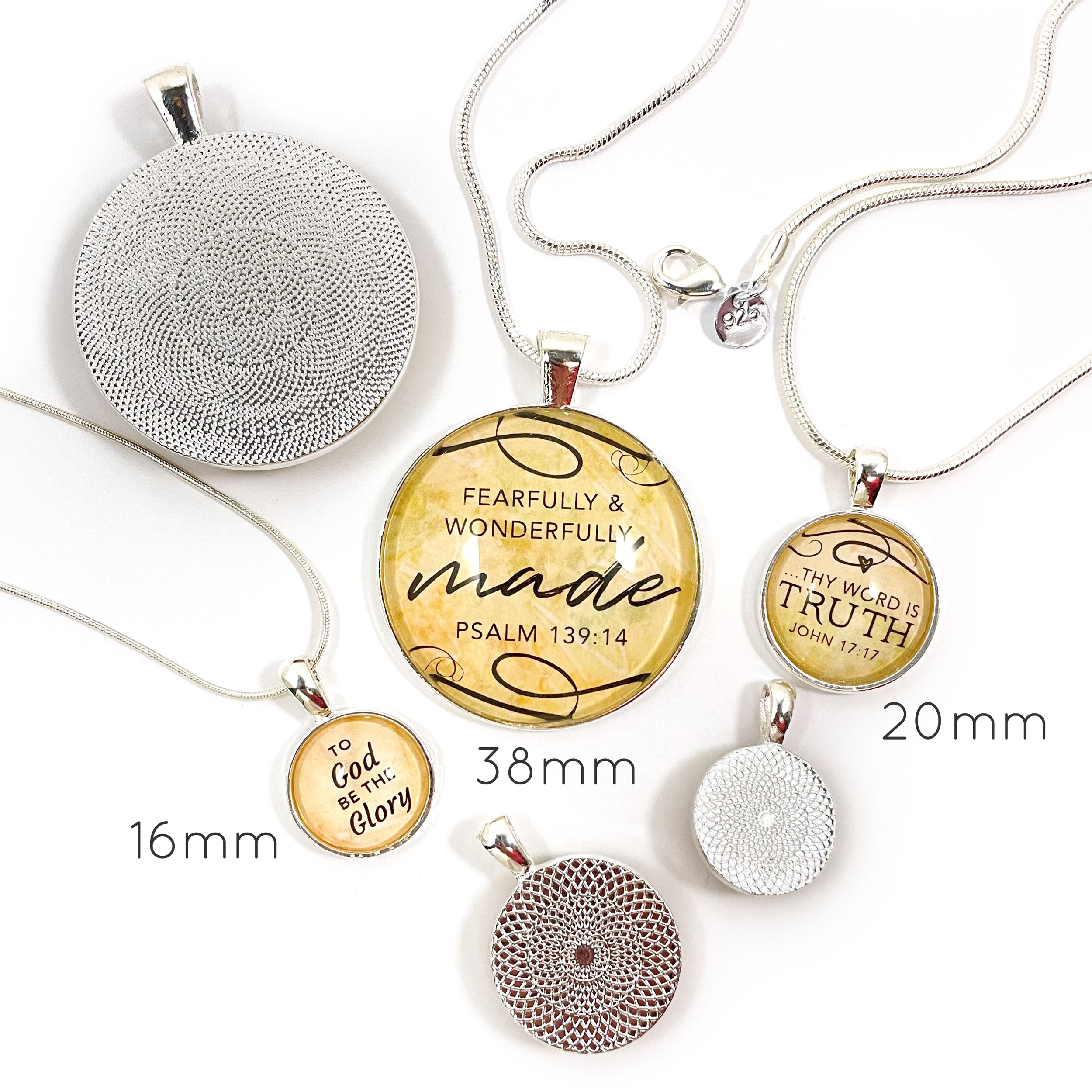 Silver-plated pendant necklace featuring the word 'Kindness' and Proverbs 3:3 scripture, with a heart illustration under glass.