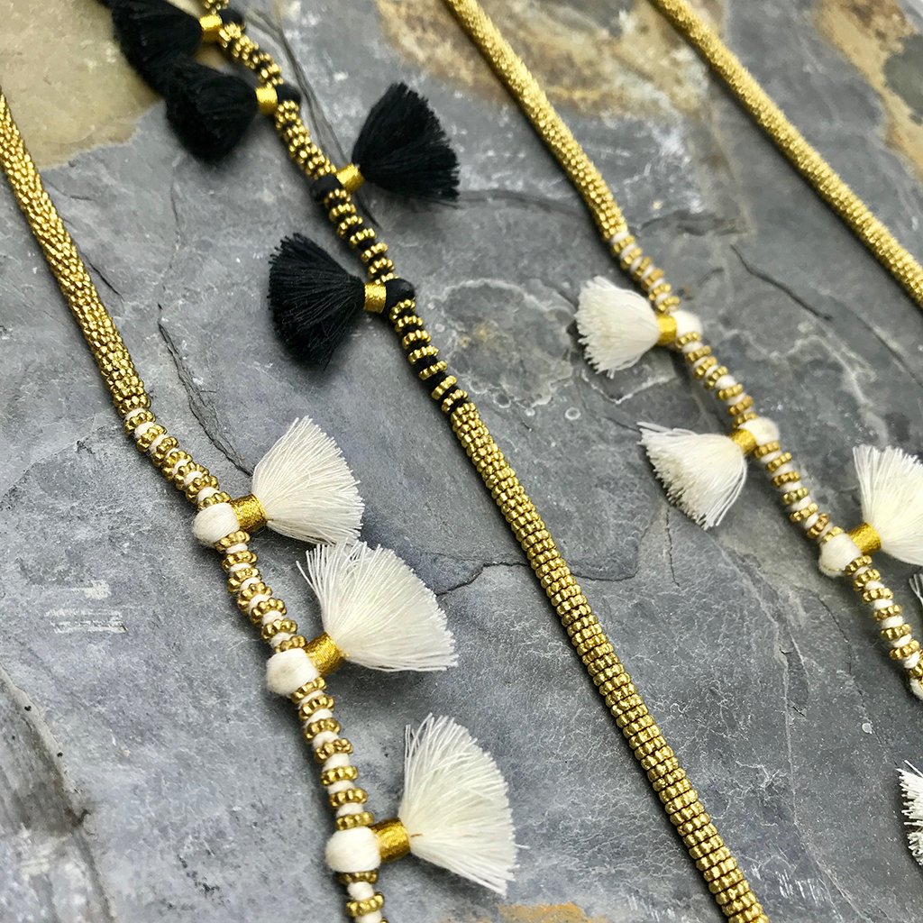 Krisha Tassel Necklace featuring cotton tassels and zinc alloy beads, showcasing a blend of traditional Indian and modern bohemian design.