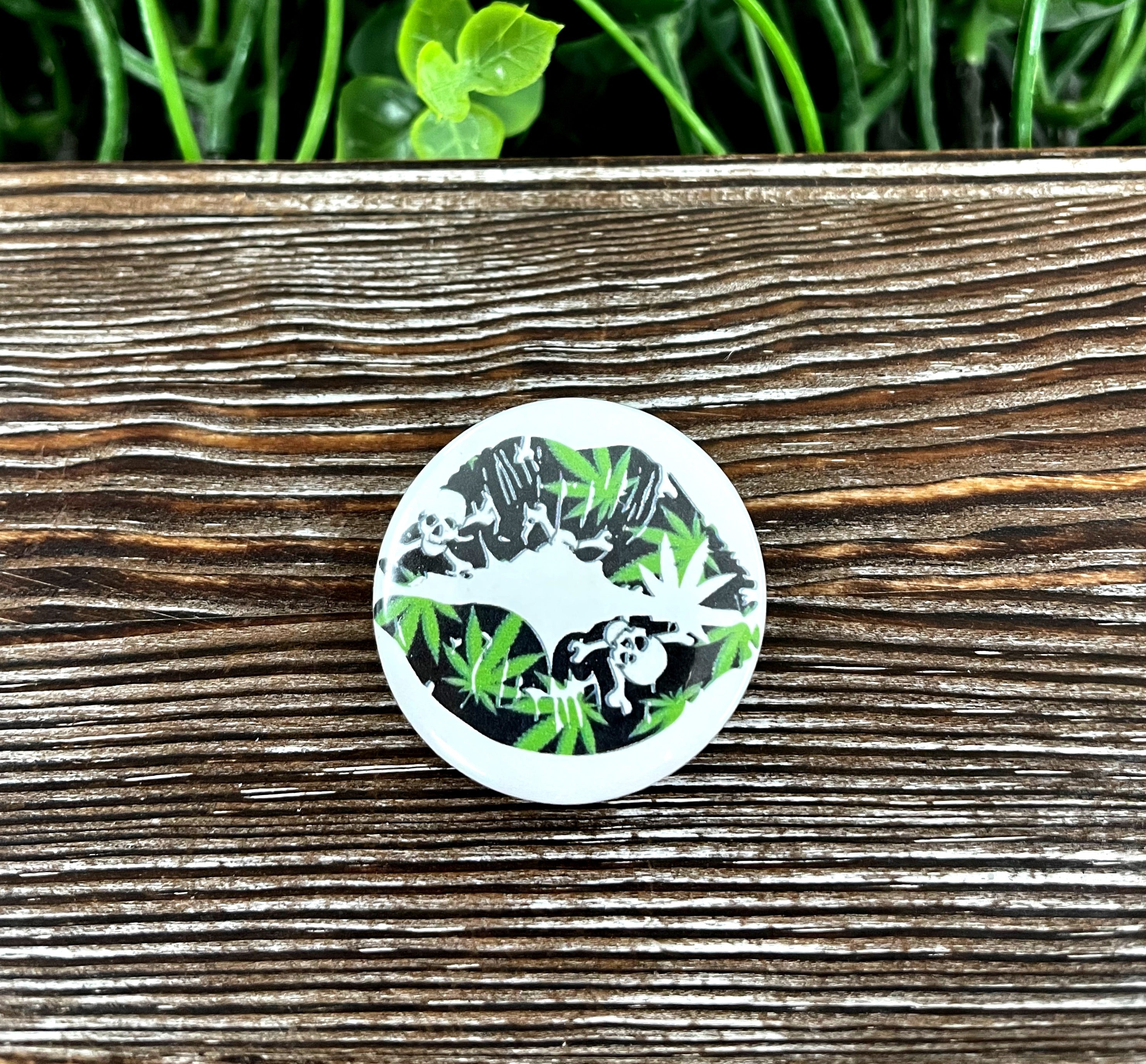 Lips Skull Green Graphic Art Button, 1.25 inches, featuring a vibrant green skull design on a plastic back.