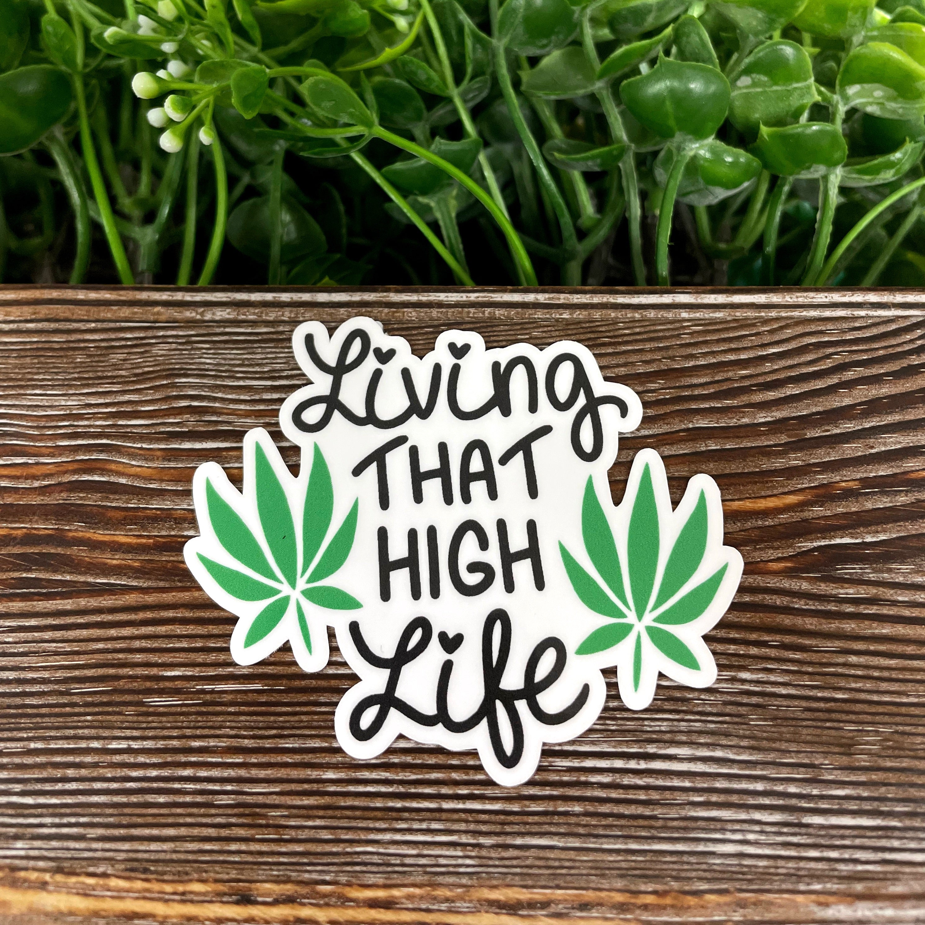 Living that High Life Cannabis die cut vinyl sticker featuring a boho design, perfect for personalizing various smooth surfaces.