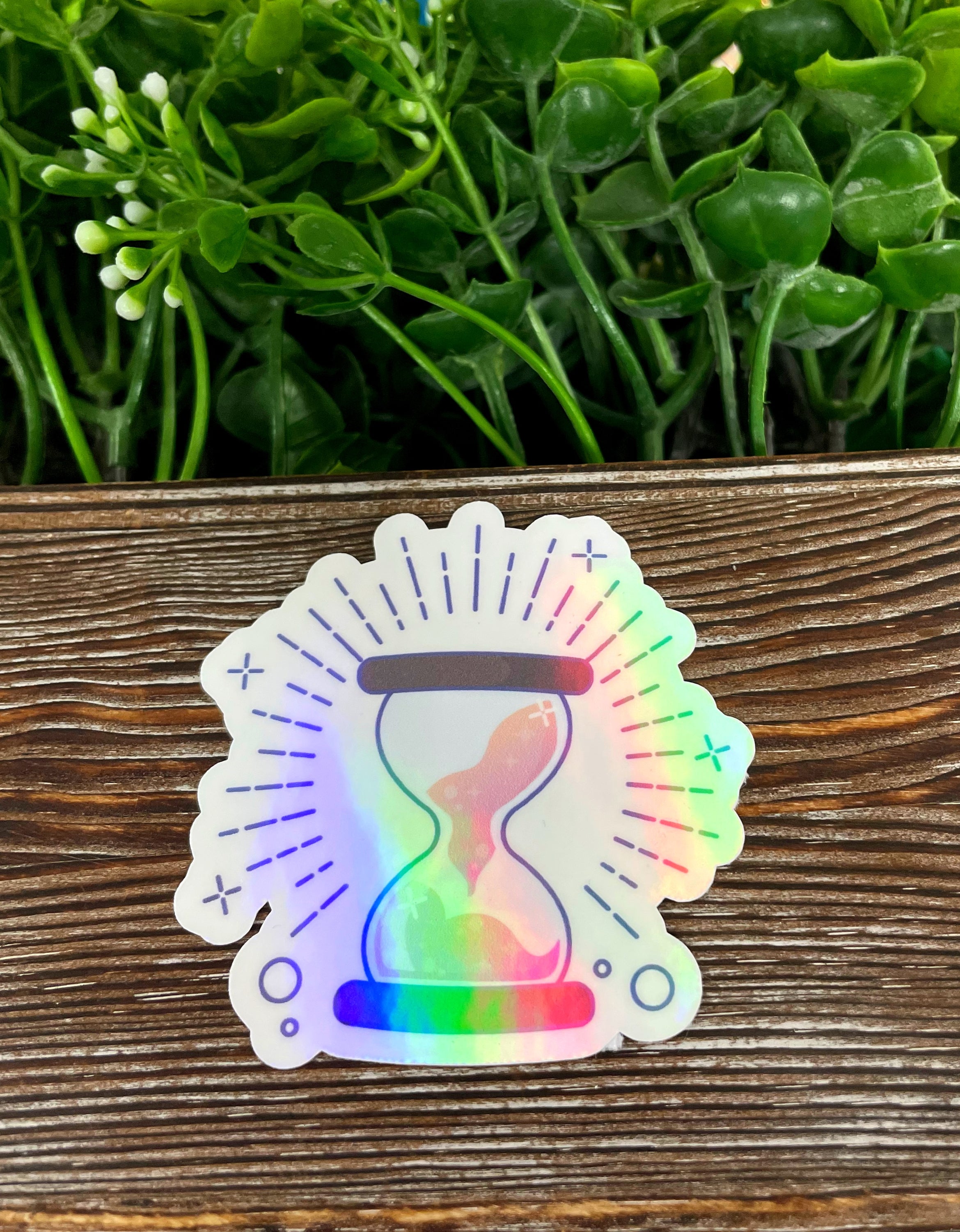 Magical Hourglass Timer die cut sticker featuring boho graphic art on a smooth surface.