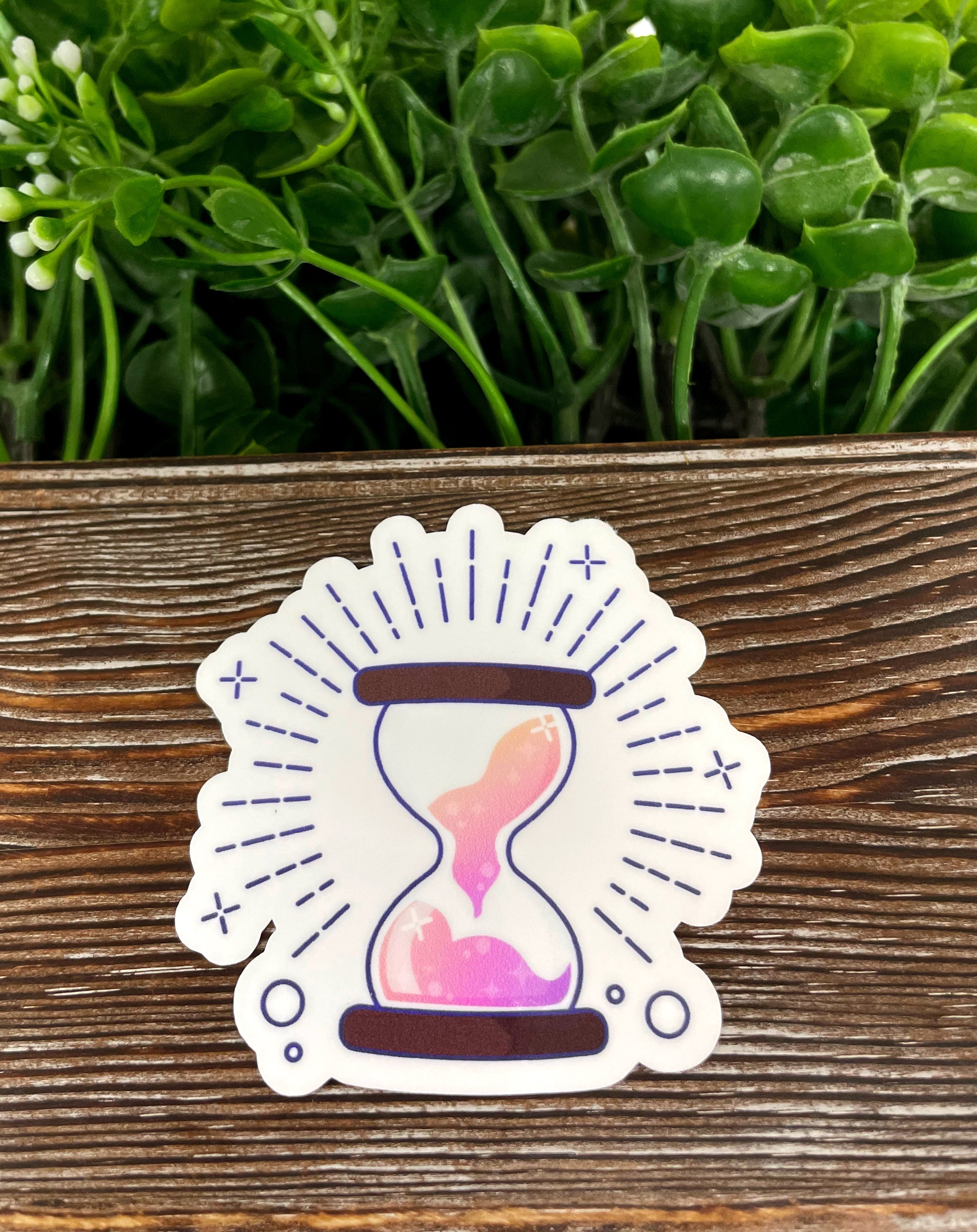 Magical Purple Hourglass die cut vinyl sticker on a smooth surface, showcasing vibrant colors and boho design.