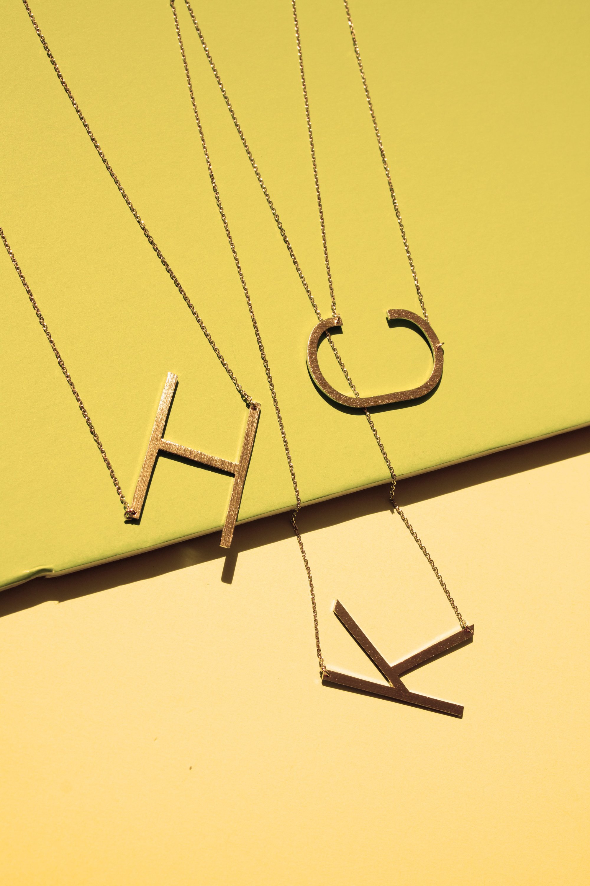 Gold-dipped brass Monogram Collection Initial Necklace with adjustable chain and elegant design.