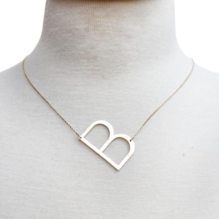 Gold-dipped brass Monogram Collection Initial Necklace with adjustable chain and elegant design.