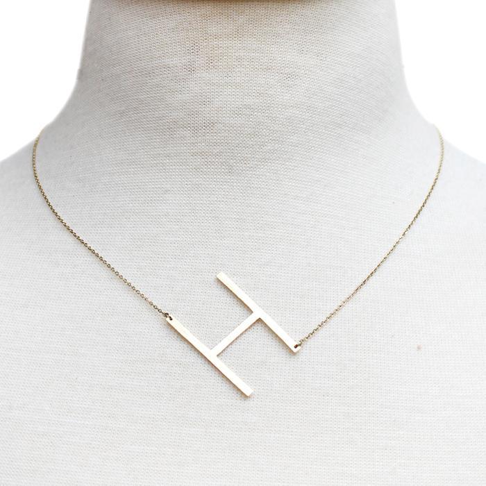 Gold-dipped brass Monogram Collection Initial Necklace with adjustable chain and elegant design.