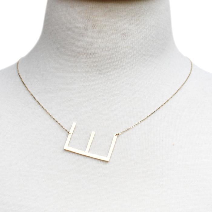 Gold-dipped brass Monogram Collection Initial Necklace with adjustable chain and elegant design.