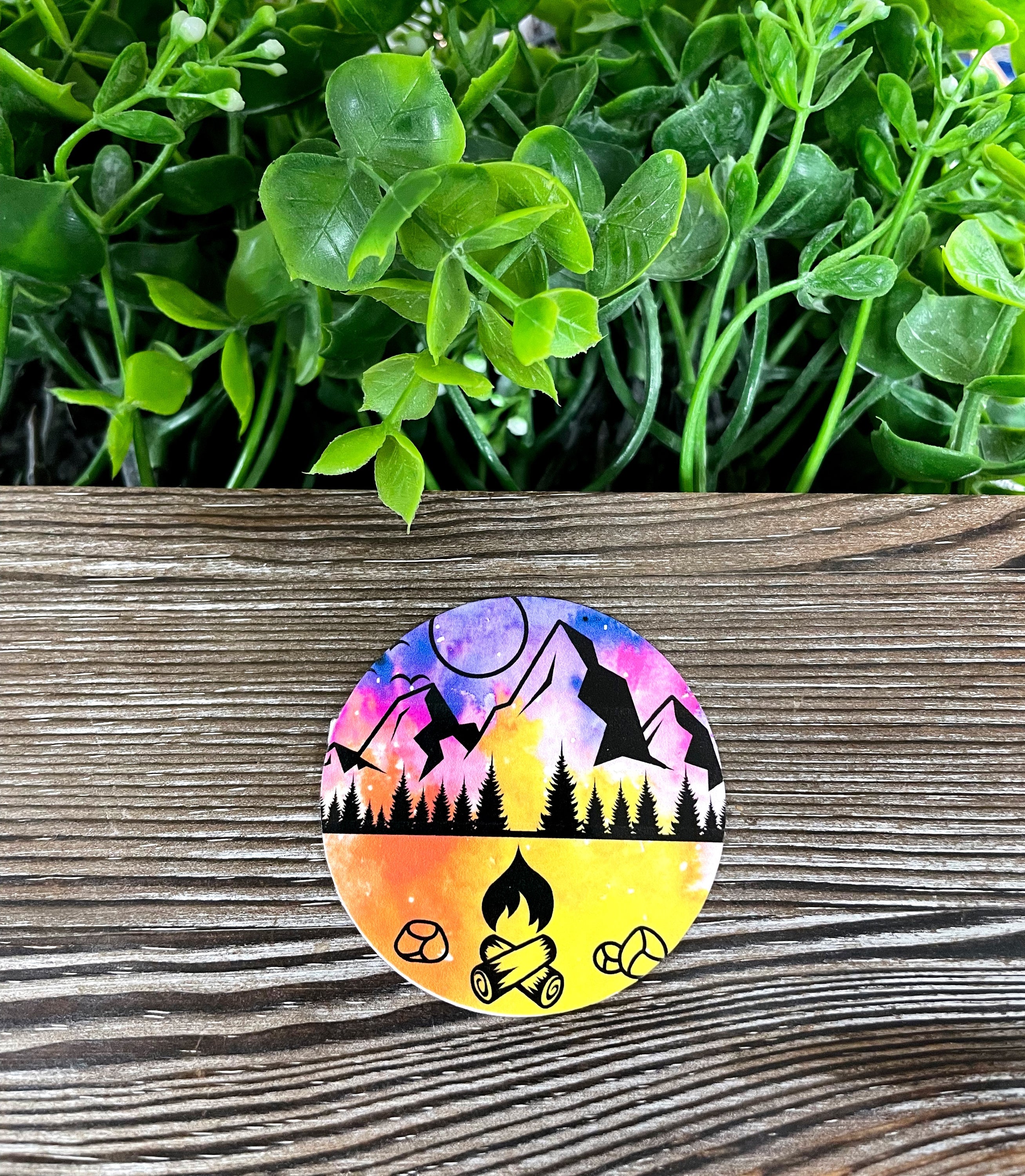 Mountain View Campfire Sticker featuring a scenic mountain landscape and campfire design, perfect for personalizing various smooth surfaces.