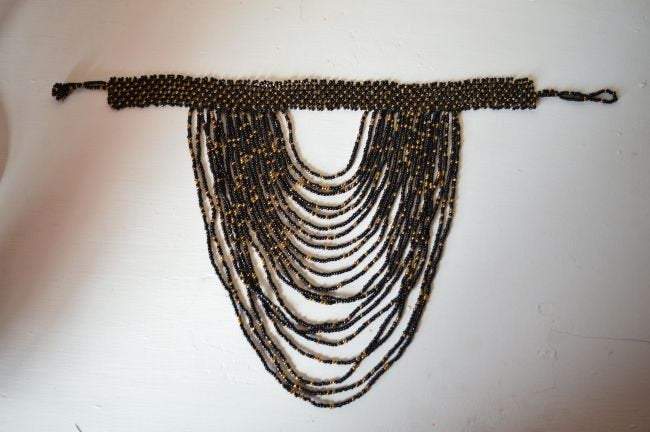 Multi-Strand Choker Necklace featuring black seed beads, elegantly crafted with multiple strands for a sophisticated look.