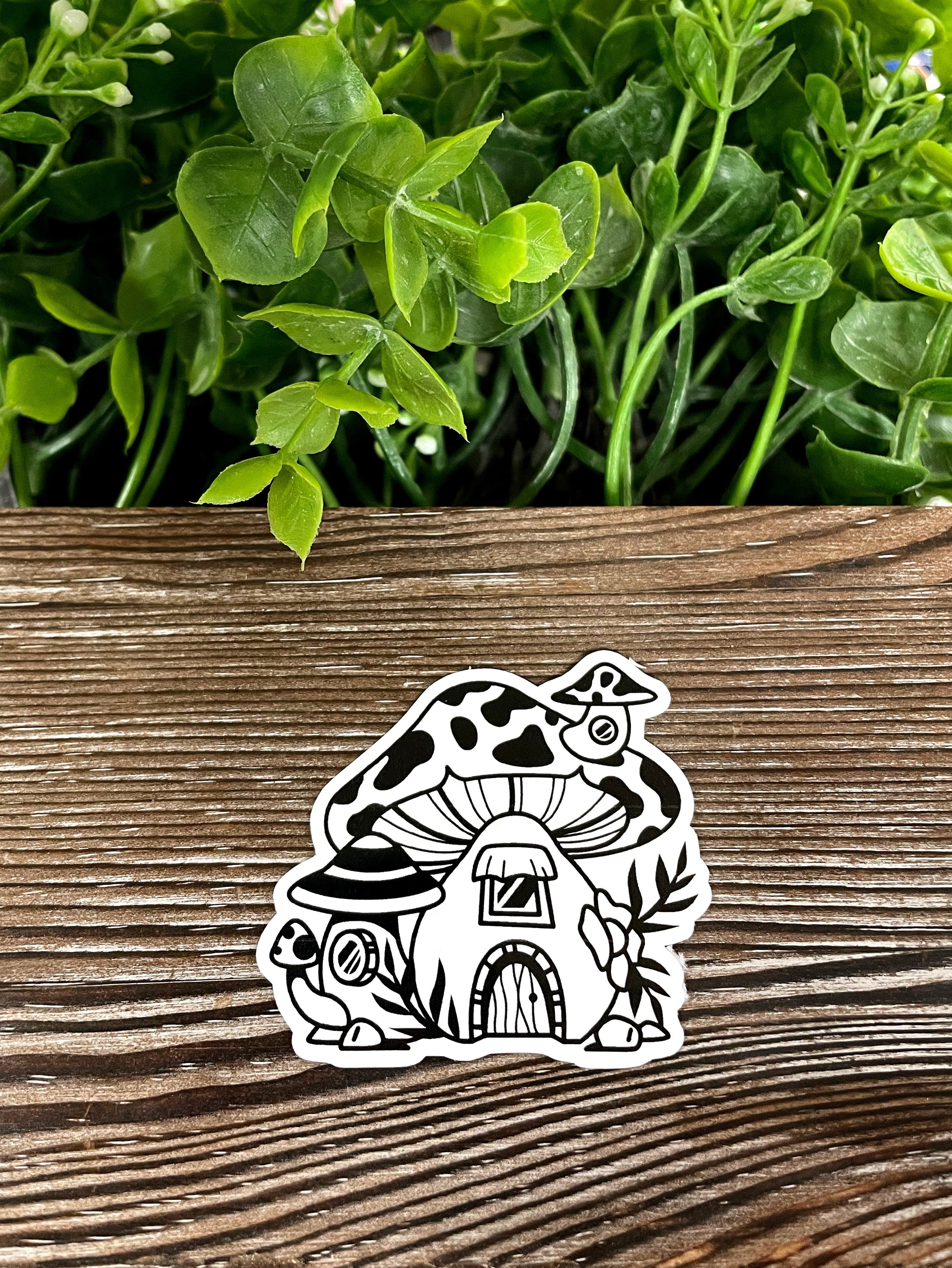 Mushroom Homes die cut vinyl sticker featuring a whimsical mushroom design, perfect for personalizing smooth surfaces.