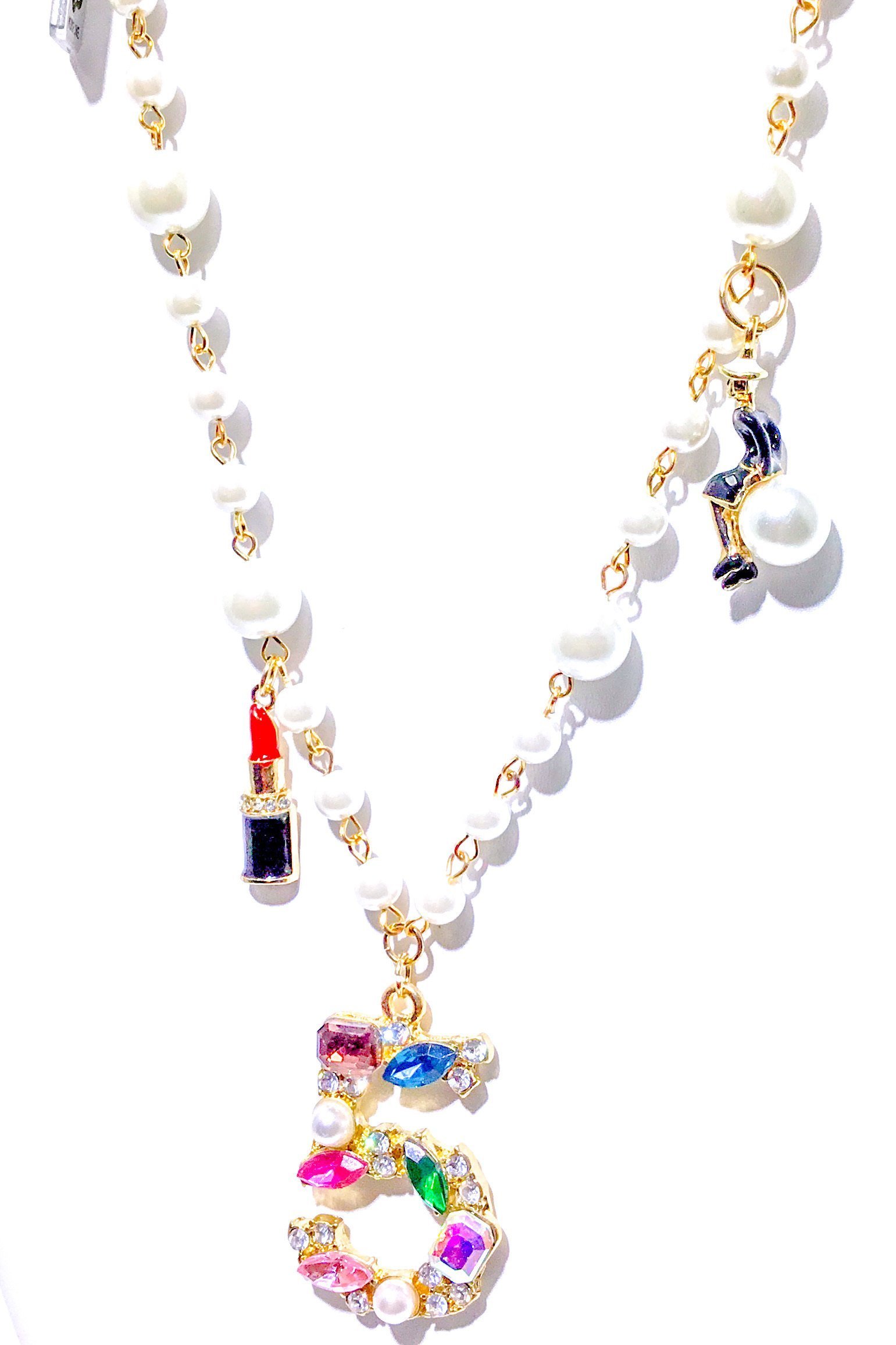 Kensington Necklace featuring embellished pearl strands in gold and multi colors, showcasing elegance and style.