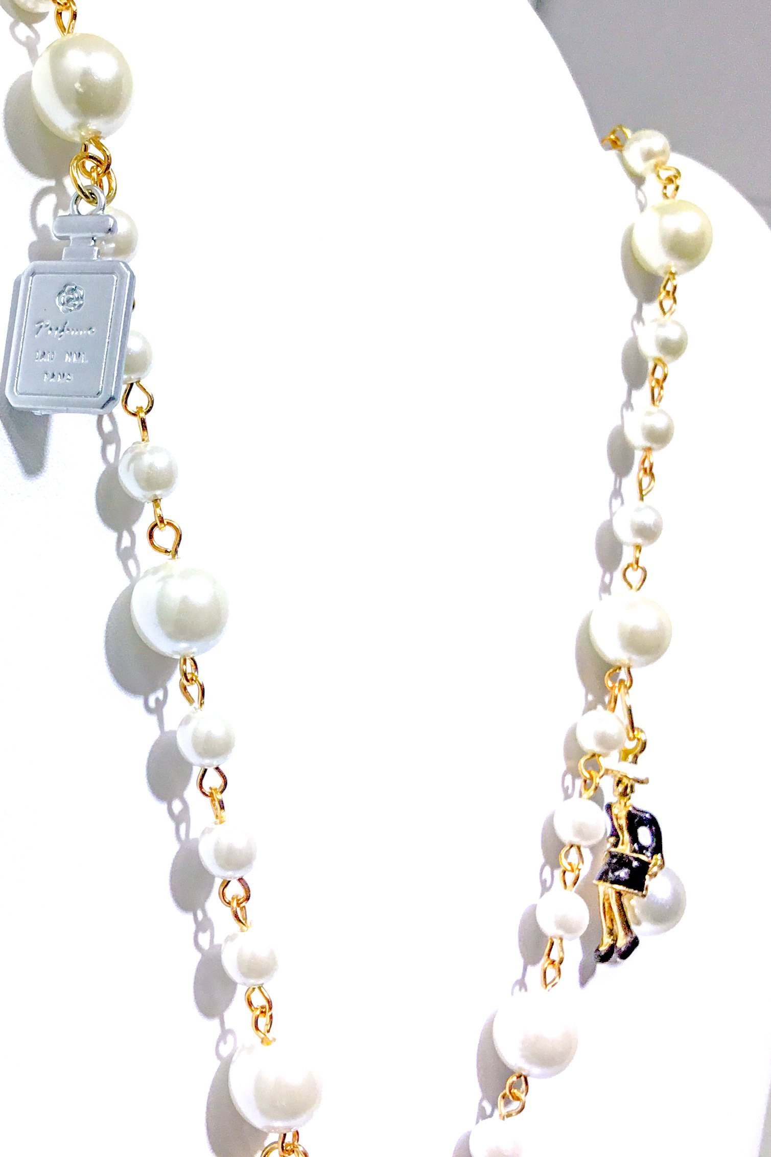 Kensington Necklace featuring embellished pearl strands in gold and multi colors, showcasing elegance and style.