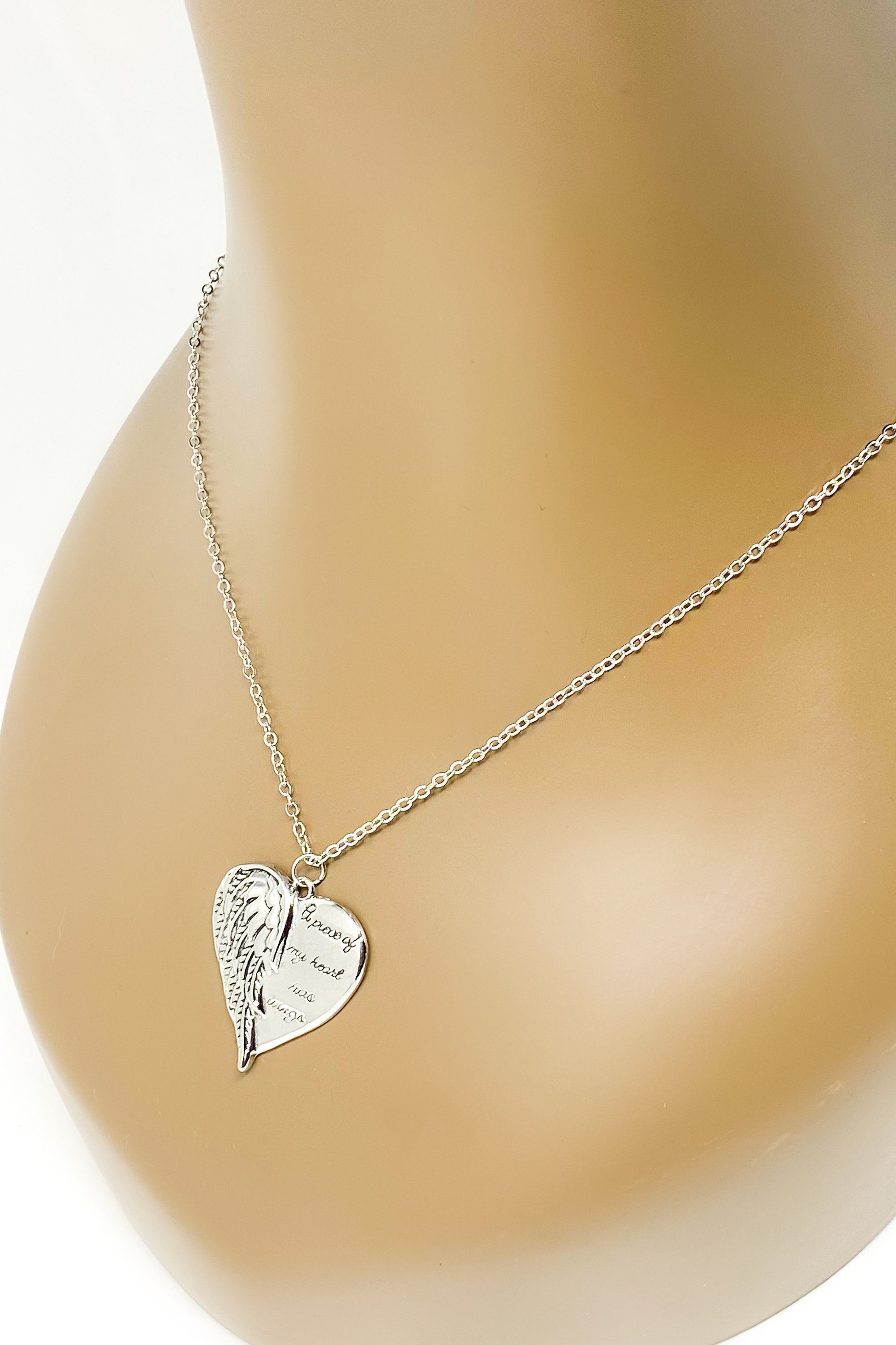 A silver remembrance necklace featuring wings, symbolizing love and memory, crafted from high-quality zinc alloy.