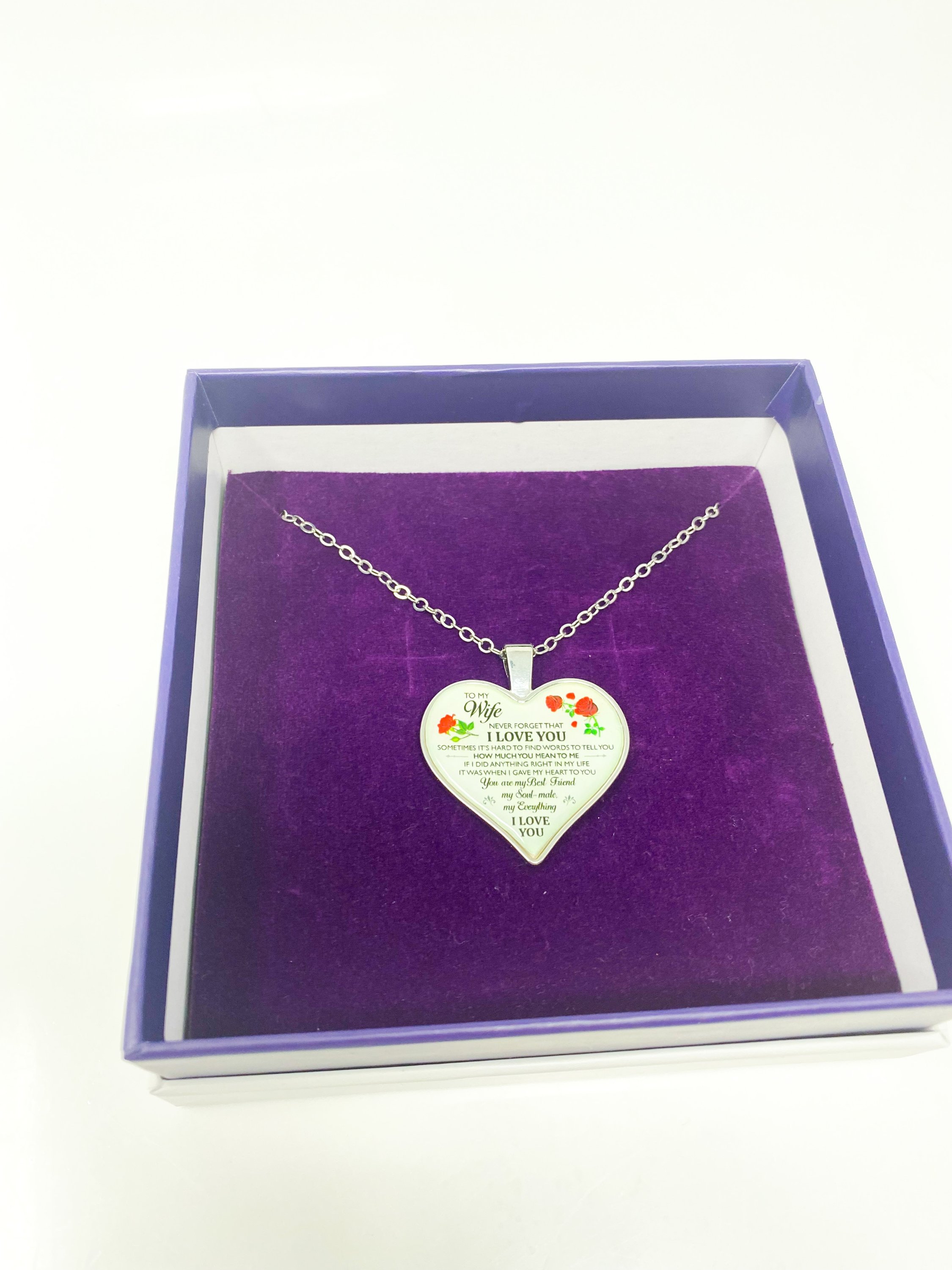 To My Wife Heart Keepsake Necklace in silver, elegantly displayed in a gift box with purple velvet inset.