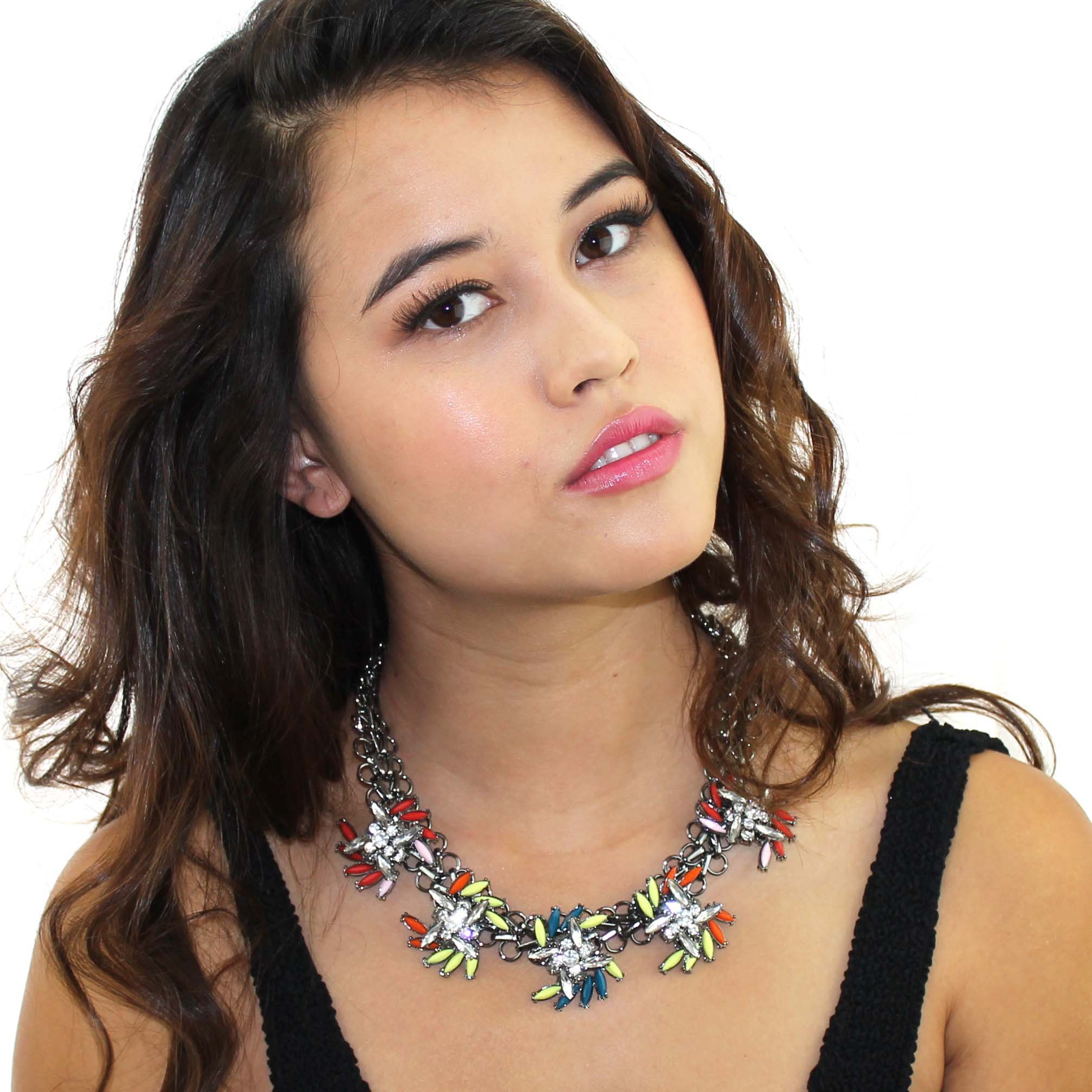 A vibrant Neon Spray Necklace featuring clusters of neon beads on a graphite silver tone chain, perfect for adding a pop of color to any outfit.